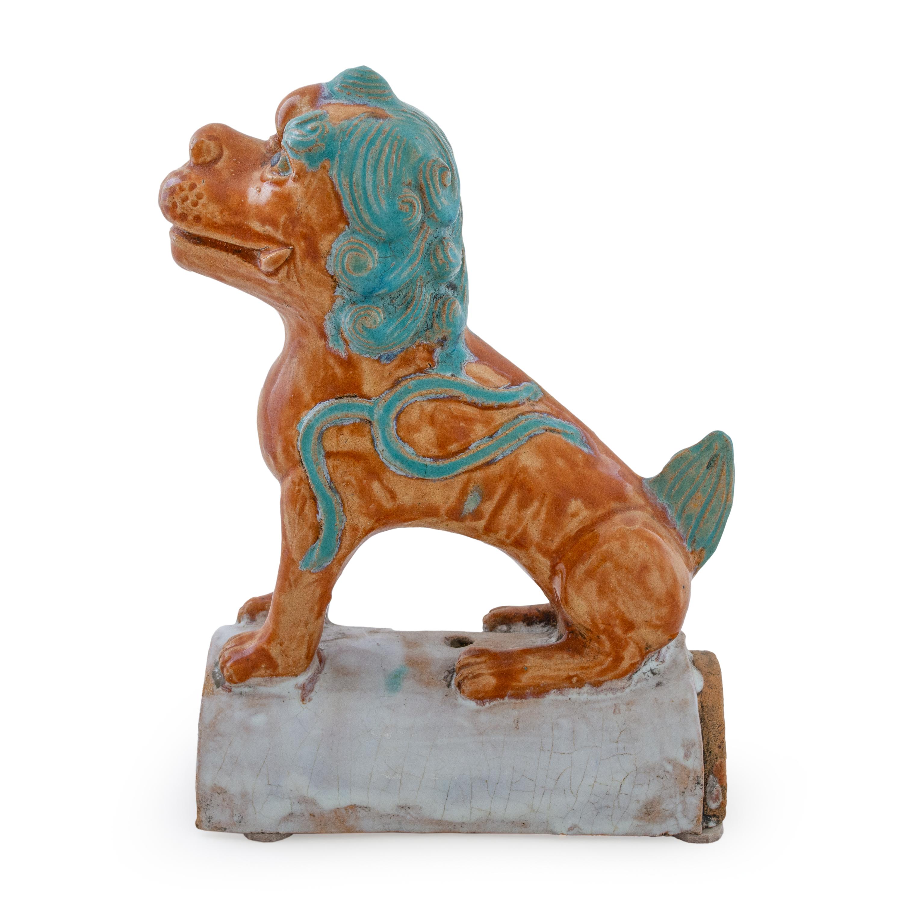 This is a charming pair of colorful terracotta roof tiles hand painted in turquoise and sienna.