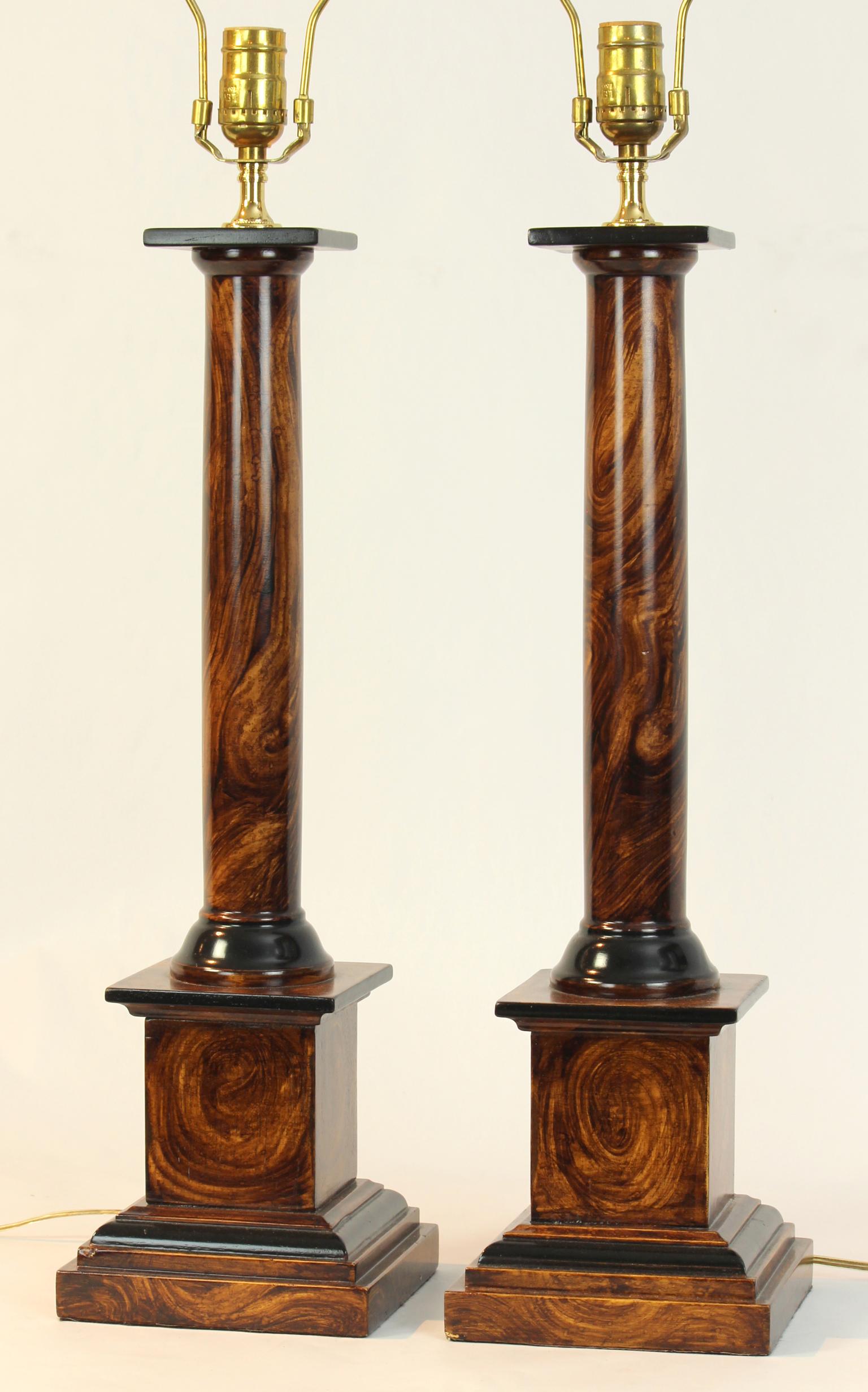 A pair of vintage neoclassical style faux bois column-form table lamps.