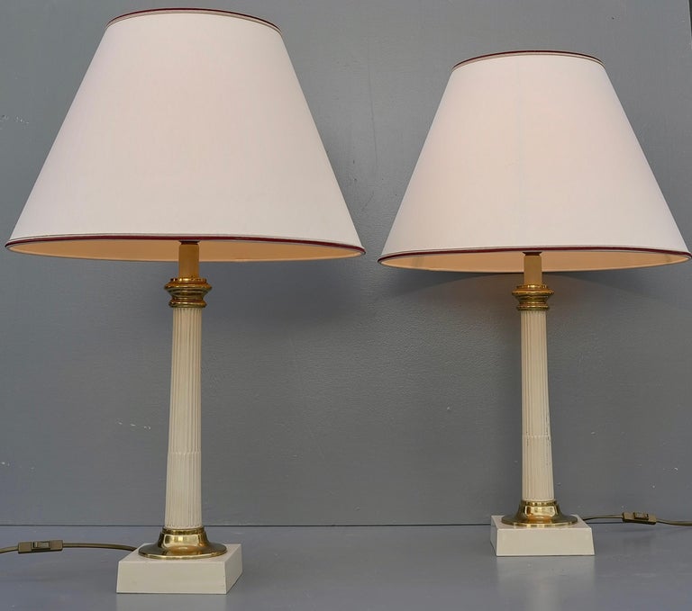 Pair of column table lamps in off white metal and brass details, France 1960's.