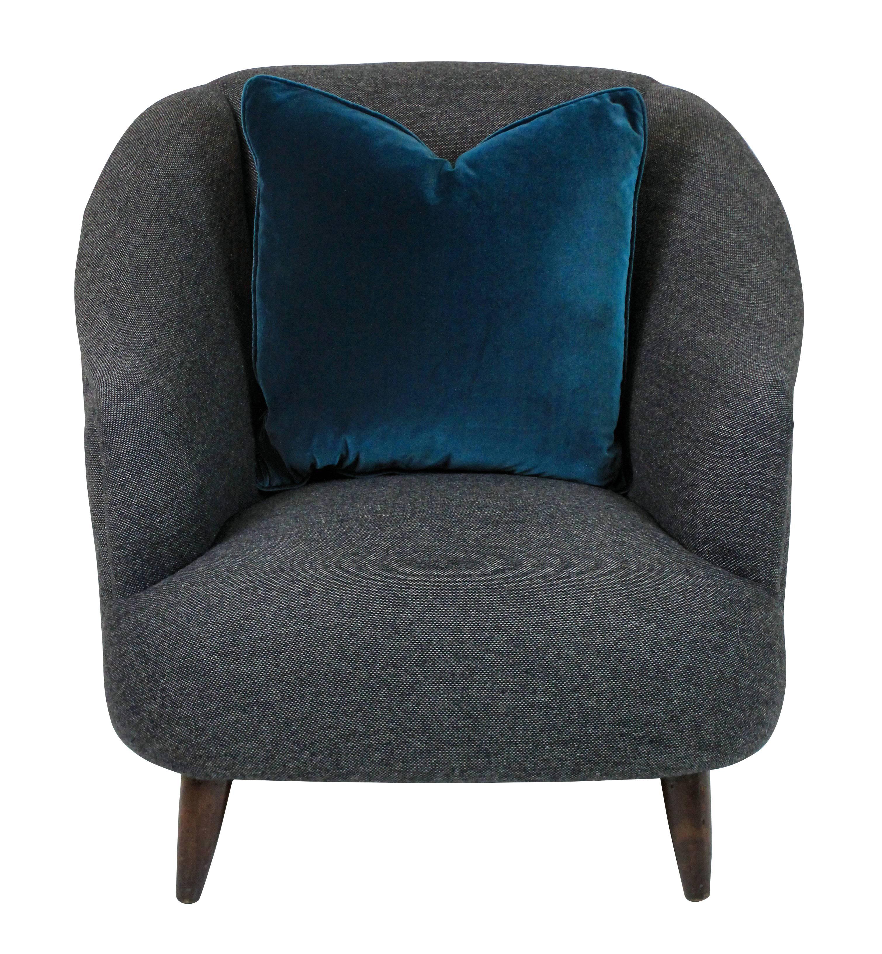 A pair of generous scale sculptural armchairs by Ulrich. Newly upholstered in dark grey wool.