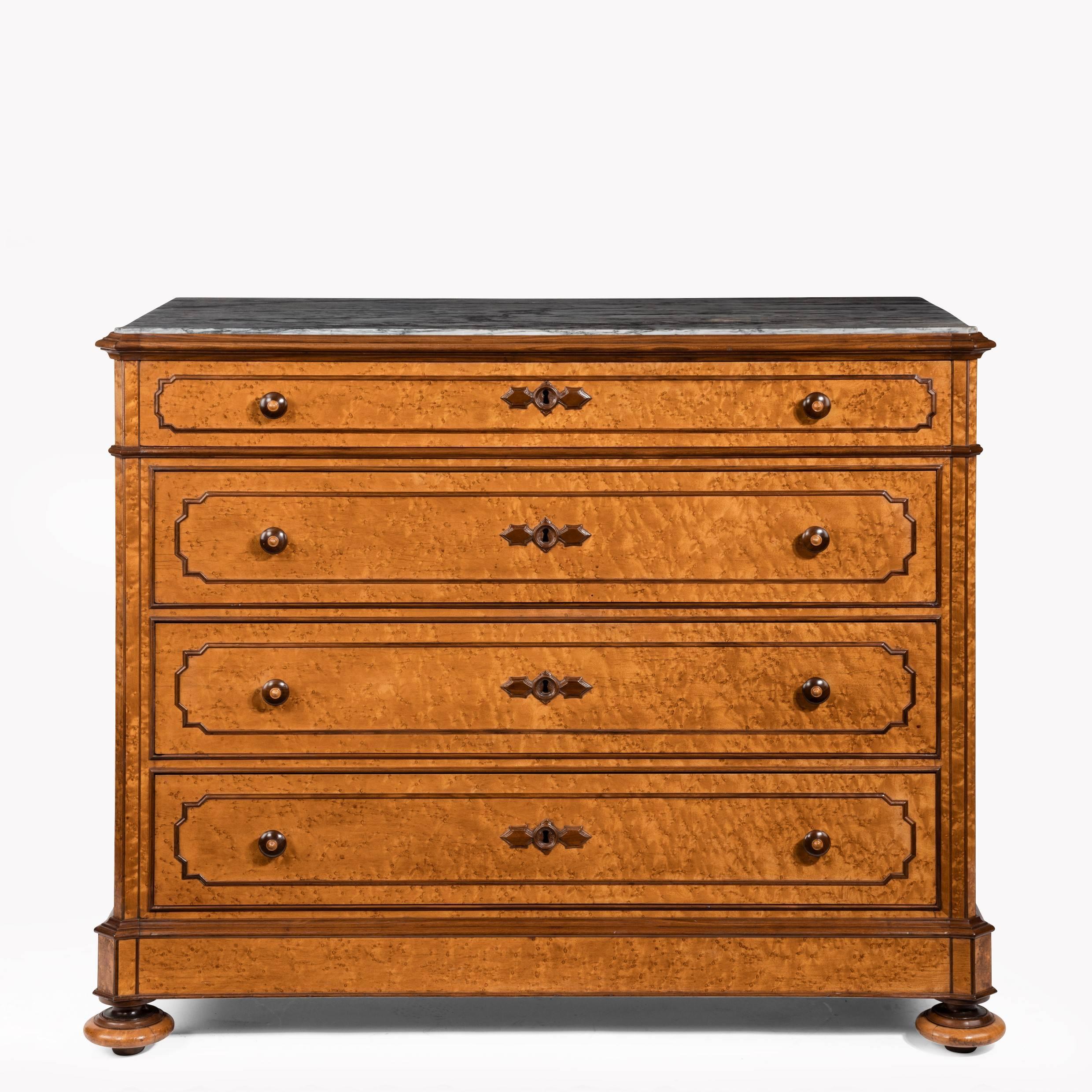 A good and unusual pair of bird’s-eye maple commodes by Zignago & Picasso, each of rectangular form with cut corners and four drawers, with the original grey marbles set into the top, decorated with solid kingwood mouldings, handles and key plat W,