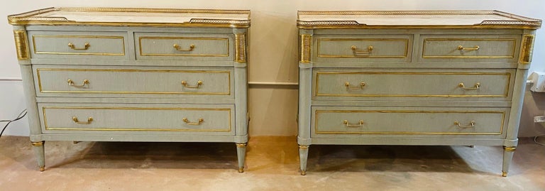Pair of faux linen look gray paint and bronze mounted Jansen style marble top commodes, night tables or chests. Stunning and spectacular are the only words to describe this pair of finely constructed commodes. The Carrara marble tops set in a bronze