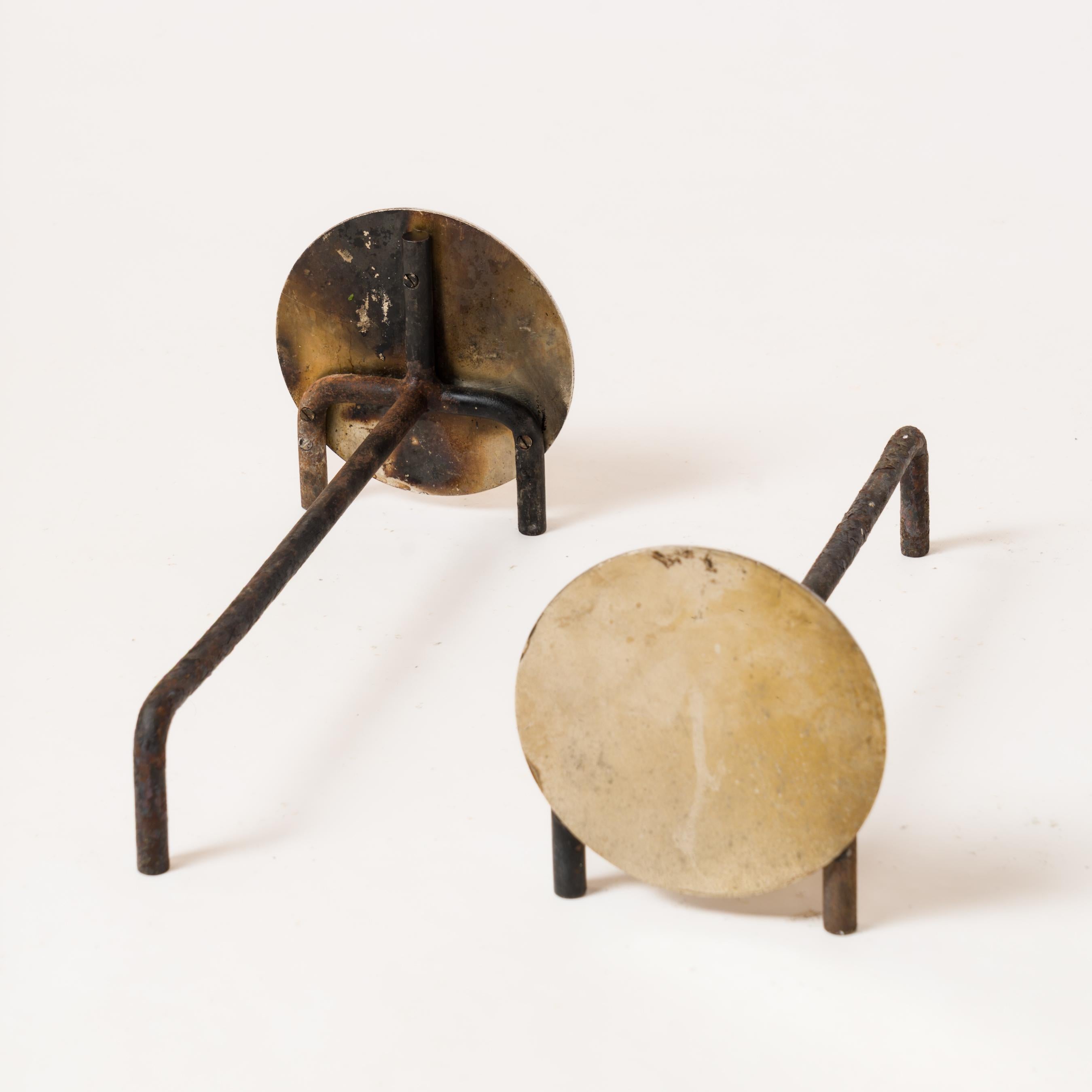 Pair of petite compact minimalist steel discs andirons - France 1970s. 
In good vintage condition.
These andirons will ship from France and can be returned to either France or to an upstate NY USA facility.
Price does not include shipping nor