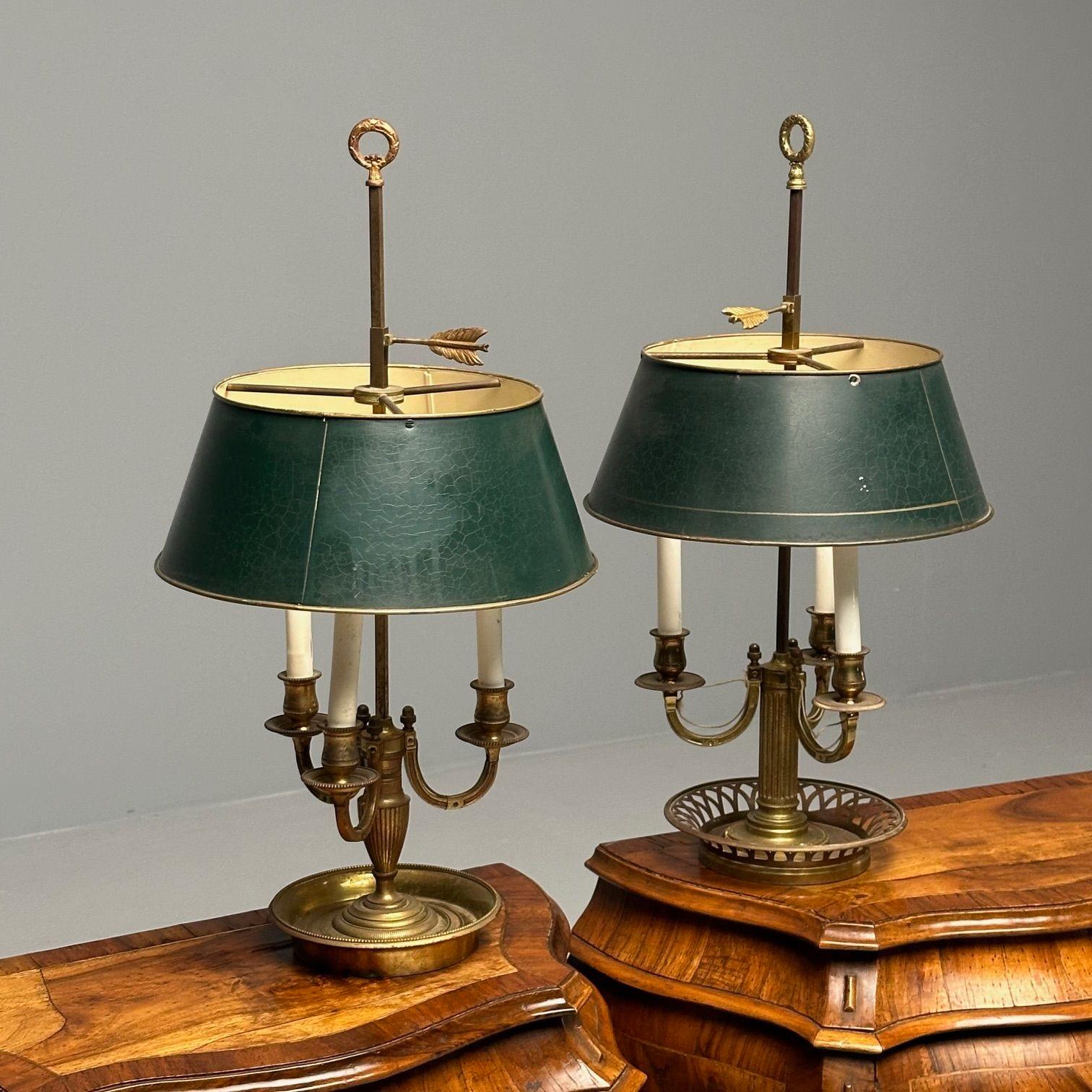 Pair of Compatible Bronze Bouillotte Table Lamps, Tole

The set having matching shades and finials with compatible bases, one urn form and one column form. Both are bronze having bronze bases one base being solid and one pierced. The pair having
