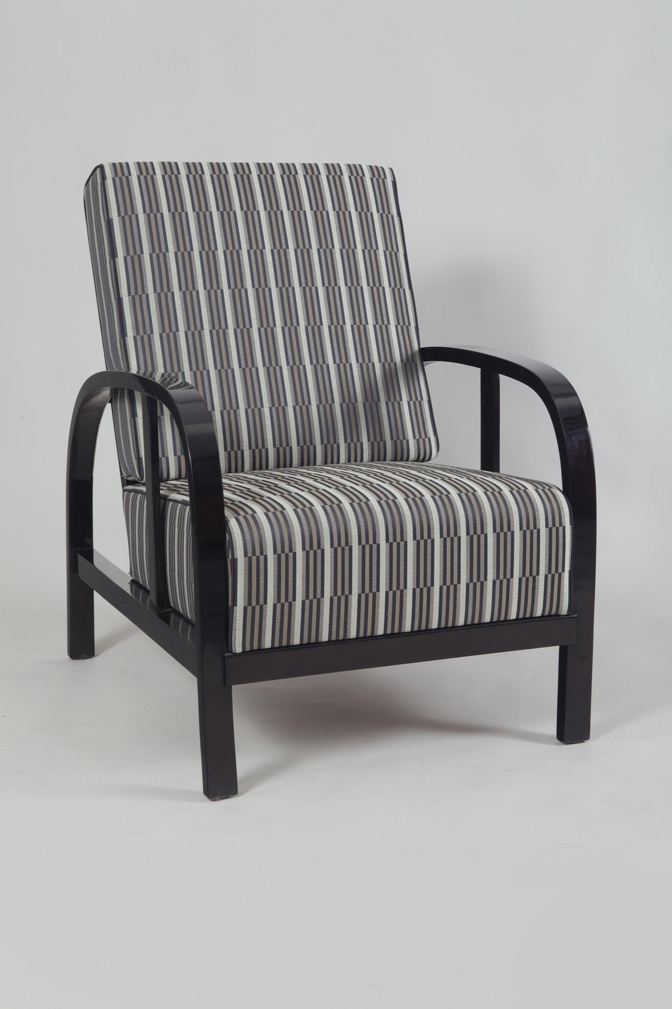Pair of adjustable armchairs in black polish, newly upholstered to the fabric Backhausen, according to the original designs. Rare, partially hidden positioning.

Source: Czechoslovakia
Period: 1930-1939.