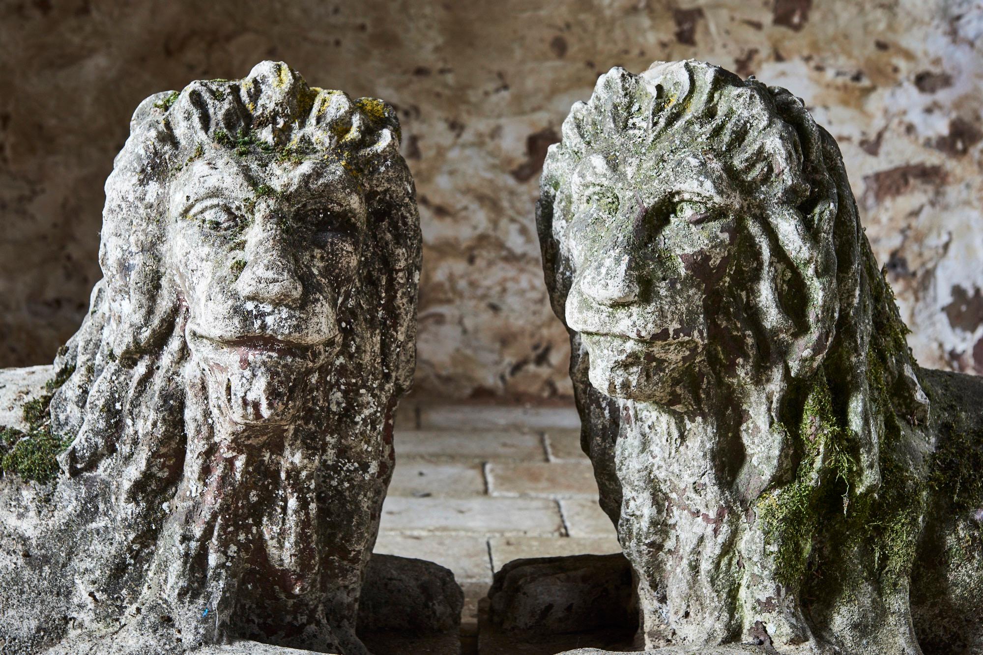 Pair of Composite Stone Recumbent Lions In Good Condition For Sale In Sidmouth, GB