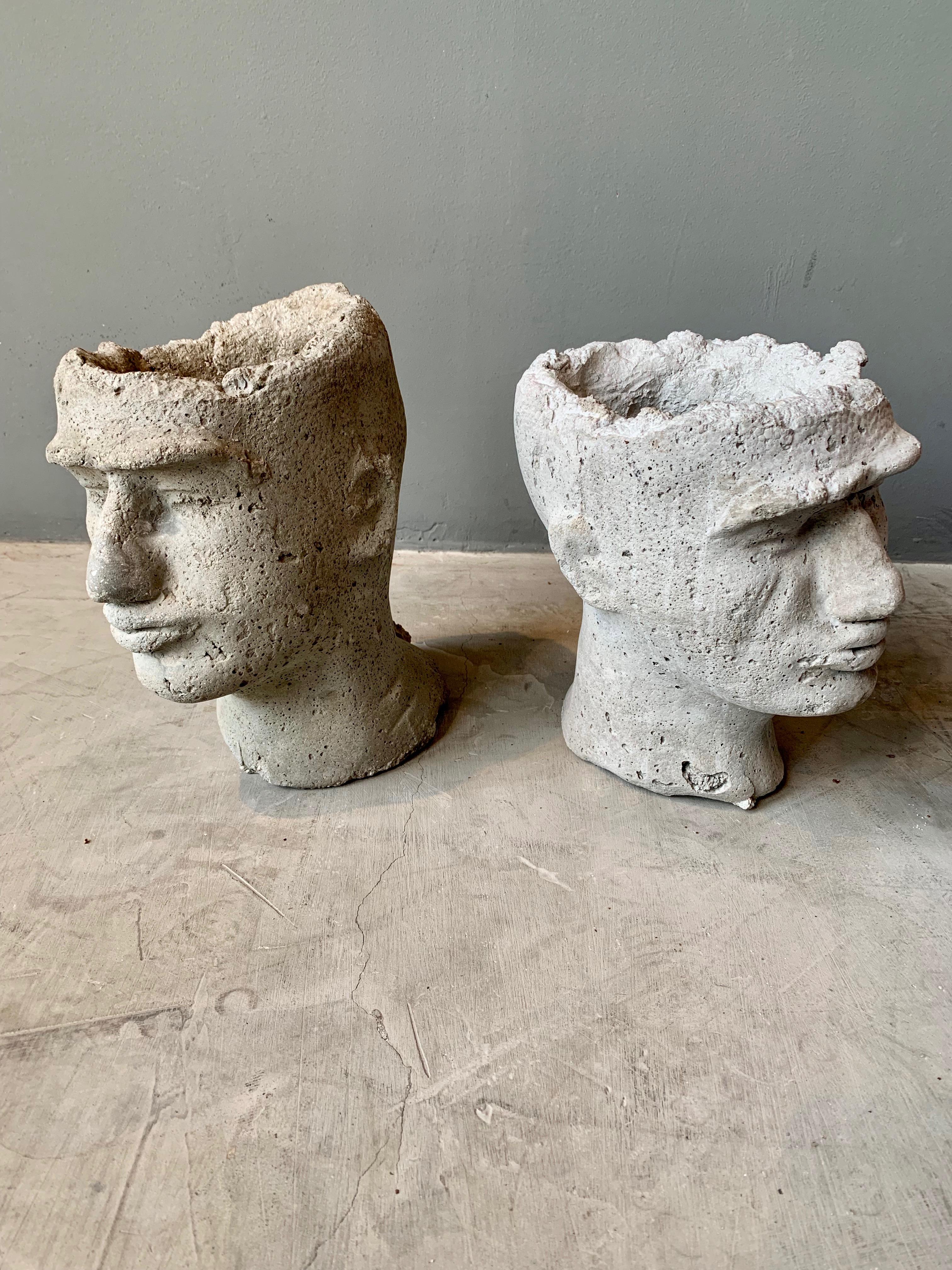 Pair of concrete head planters. Hand made. Hold pre-drilled in the back for water to escape. Cool tabletop sculpture for indoors or outside. Two available. Priced as a pair. 

Each head is 8.5