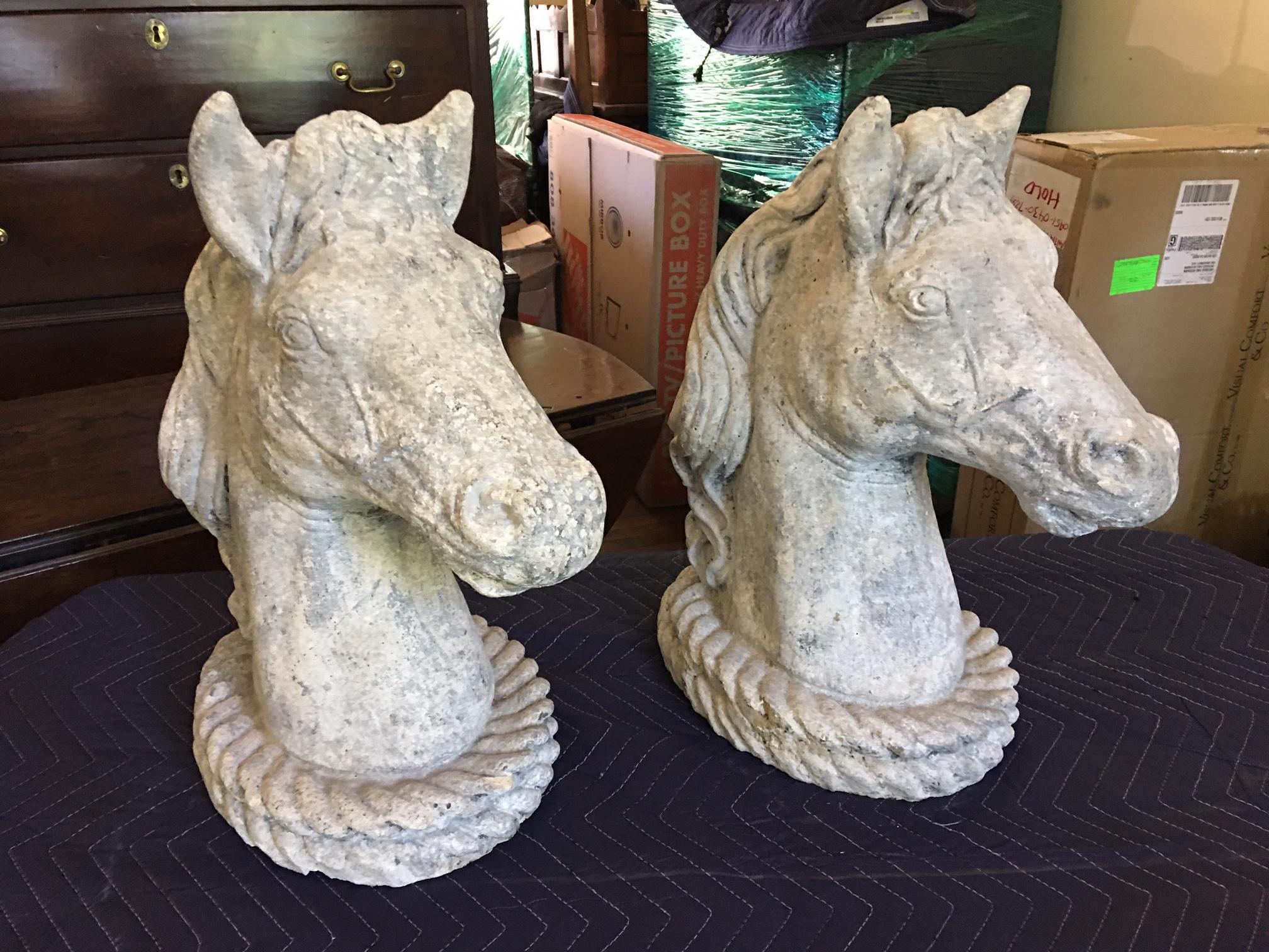 Pair of concrete horse heads, circa 1950s.