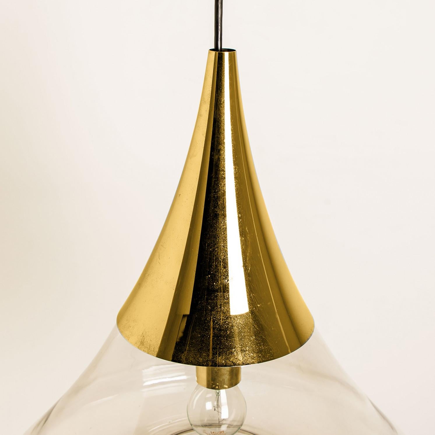 Mid-Century Modern Pair of Cone Shape Brass and Clear Glass Pendant Lights by Limburg For Sale