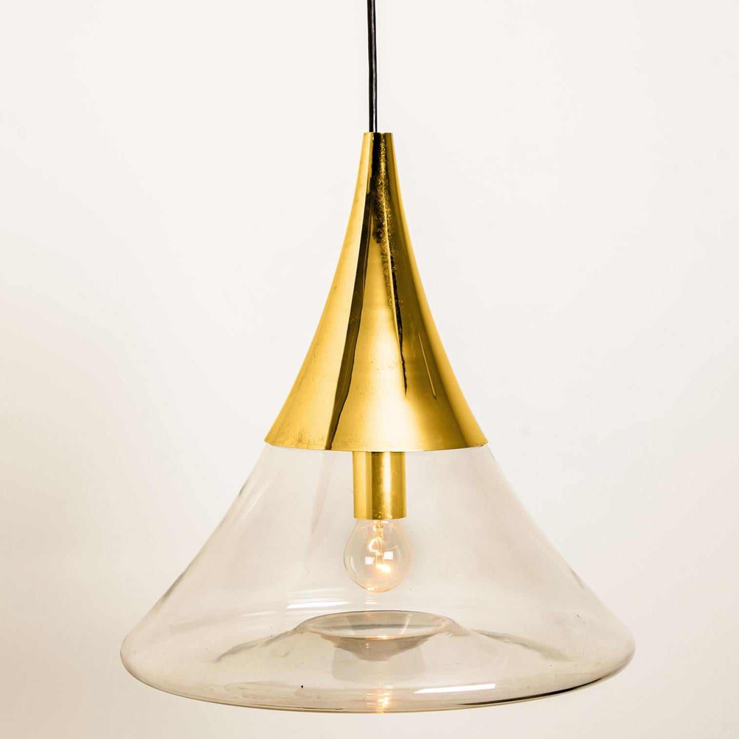 Pair of Cone Shape Brass and Clear Glass Pendant Lights by Limburg In Good Condition For Sale In Rijssen, NL