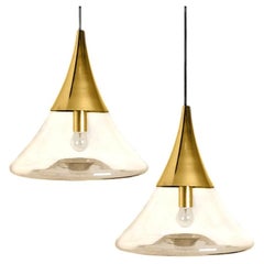 Pair of Cone Shape Brass and Clear Glass Pendant Lights by Limburg