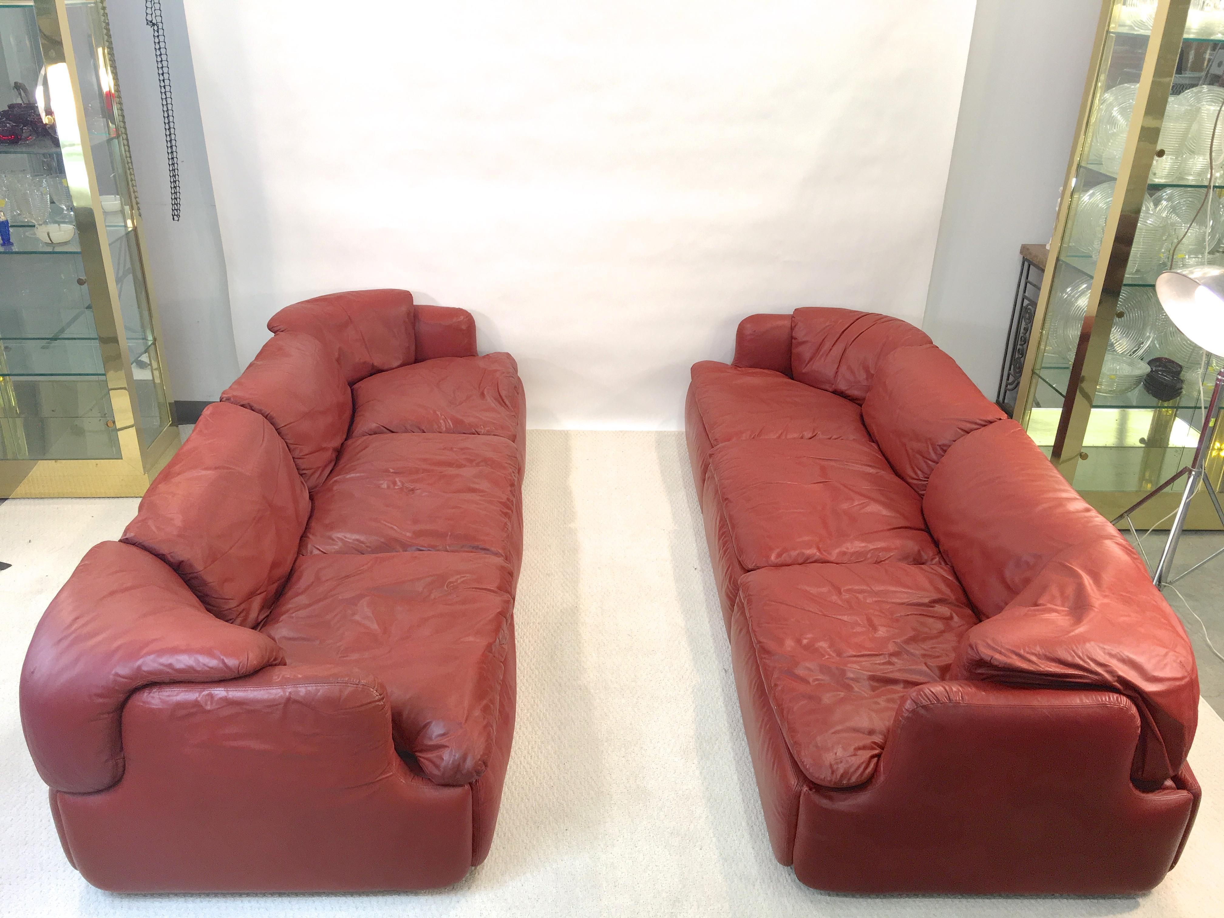 
We have ONE brick red/cordovan leather sofa and matching armchair. Two pieces total. (The second sofa has been sold).

Price shown is for the sofa and the chair together.

An important pair of leather three-seat sofas and lounge chair designed by