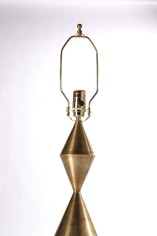 Pair of hand wrought conical brass sculpture table lamps.
 Available in brass, antique patinated brass, and gunmetal finishes. 
Lamp body height 27