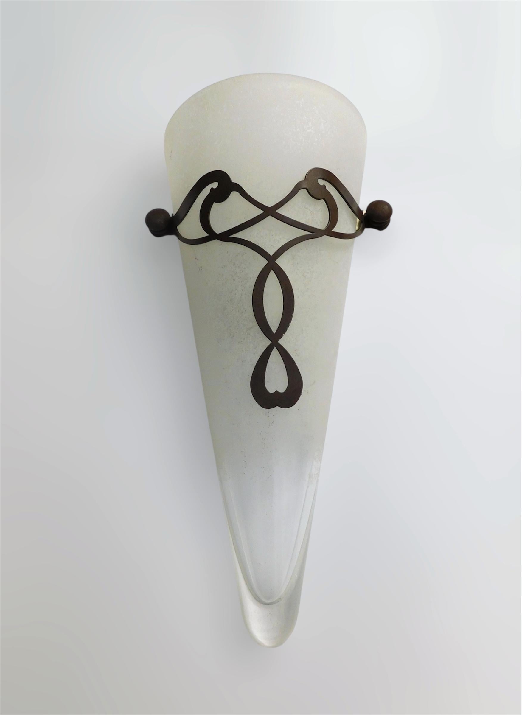 Italian wall light with frosted cone shaped Murano glass diffuser and bronze embroidery / Made in Italy, circa 1960s
Measures: height 16 inches / width 8.5 inches / depth 3.5 inches
1 light / E12 or E14 type / max 40W
2 pairs available in stock in