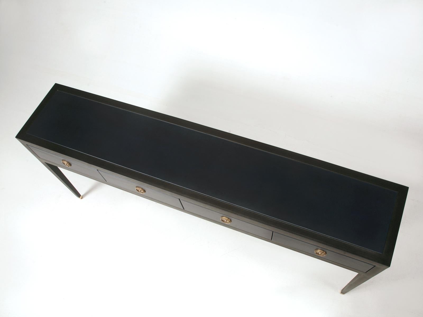 From the Old Plank Furniture Collection, are a Matched Pair (also available separately) of Ebonized Mahogany and Leather Wrapped Console Tables. Our Sofa Tables or Console Tables are handcrafted in the Old Plank workshop here in Chicago and are