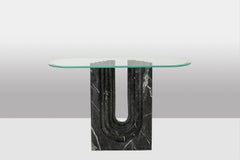 Pair of console tables in marble with glass tops. 1980s.