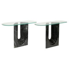Pair of console tables in marble with glass tops. 1980s. Pair of console tables in marble with glass tops. 1980s.