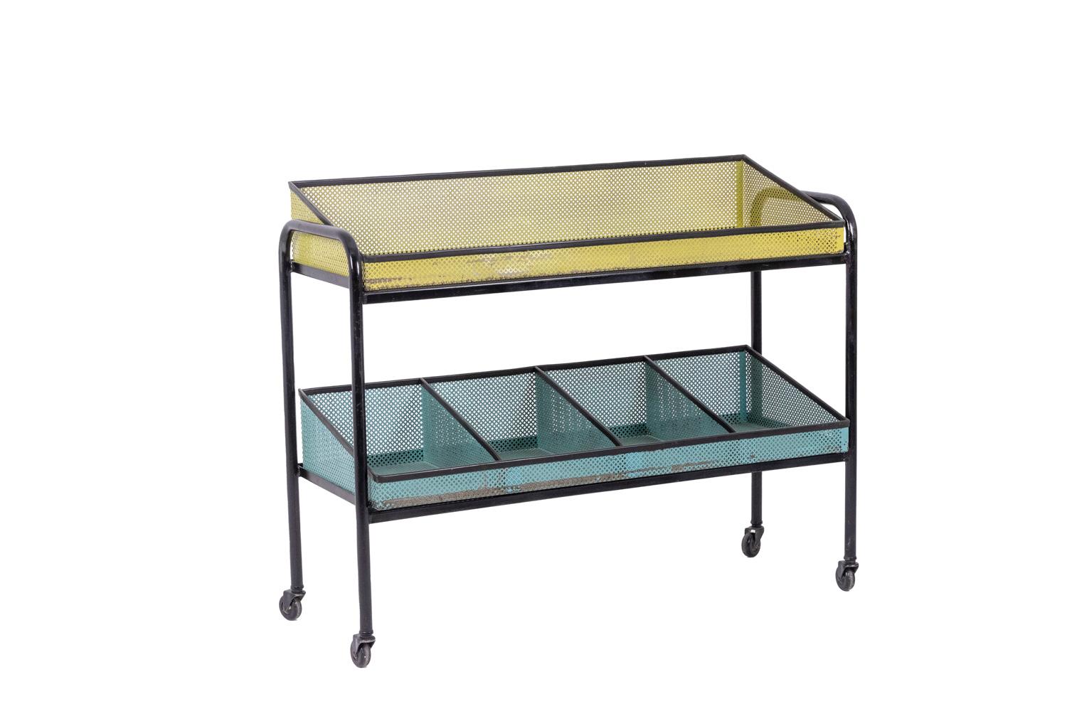 Pair of consoles with two interchangeable and removable rows in perforated sheet metal decorated with stars and circles, one of the two trays with four compartments, yellow and blue. Base in black lacquered metal resting on casters.

Possibility