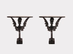 Pair of console tables with griffons in ebonized walnut wood, Italy 1860.