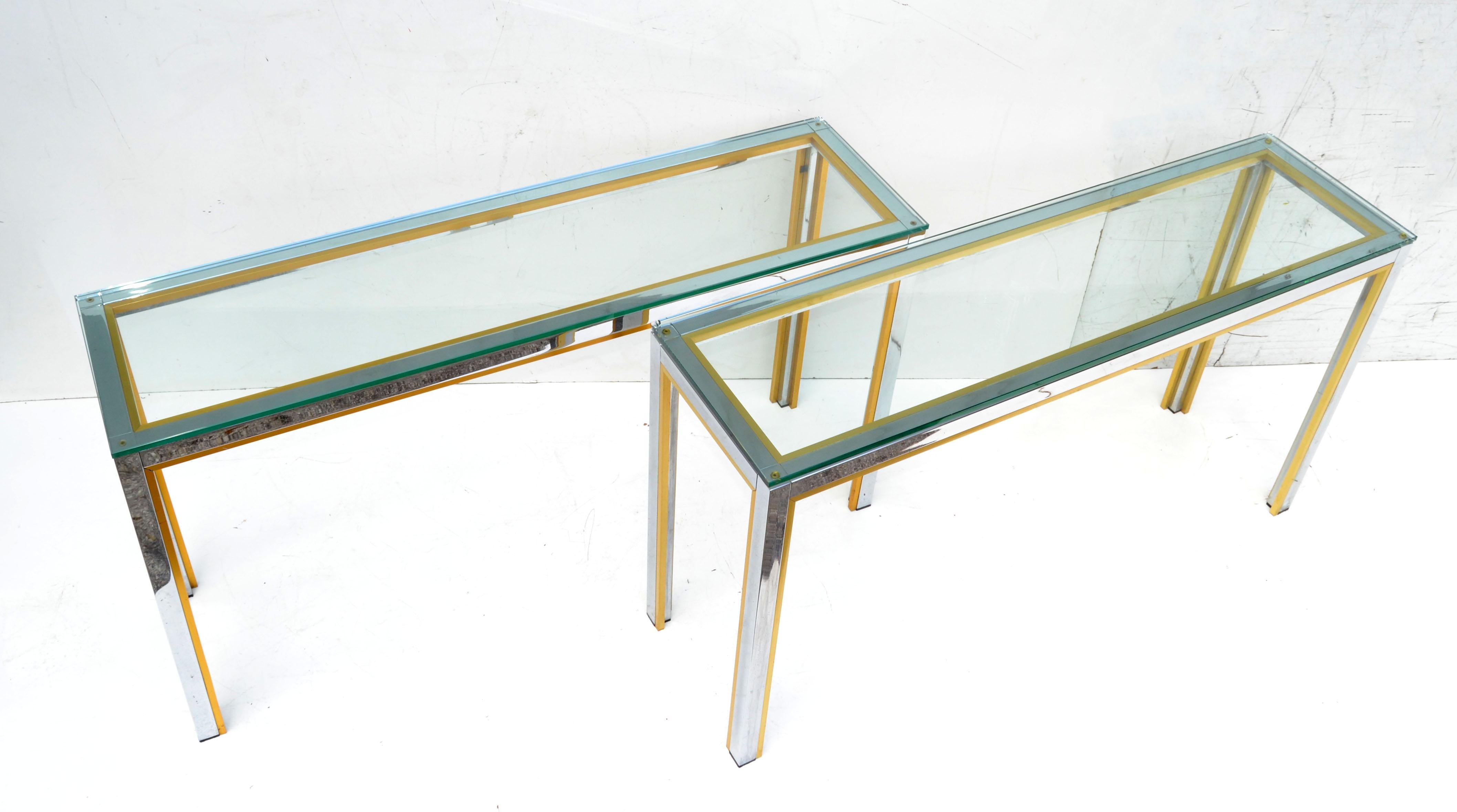 Mid-Century Modern pair of long consoles by Zilli Italy in the 1970.
Made out of Chrome with Brass Inlay and Tops are made out of thick clear beveled Glass.
Great for the Hallway or as Sofa Tables.