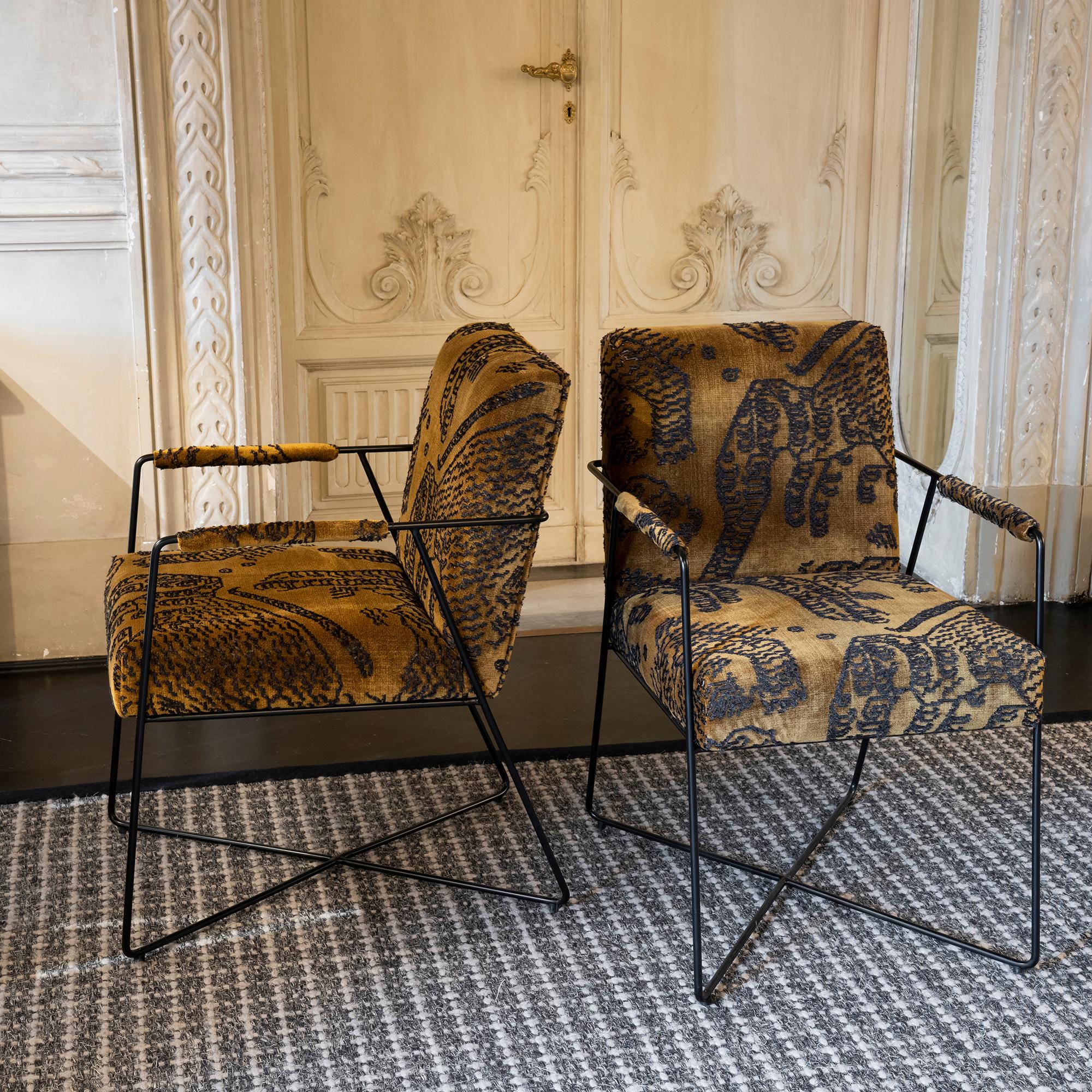 Pair of contemporary armchairs, black steel structure, upholstered with dark gold tiger Mountain jacquard velvet by Dedar.