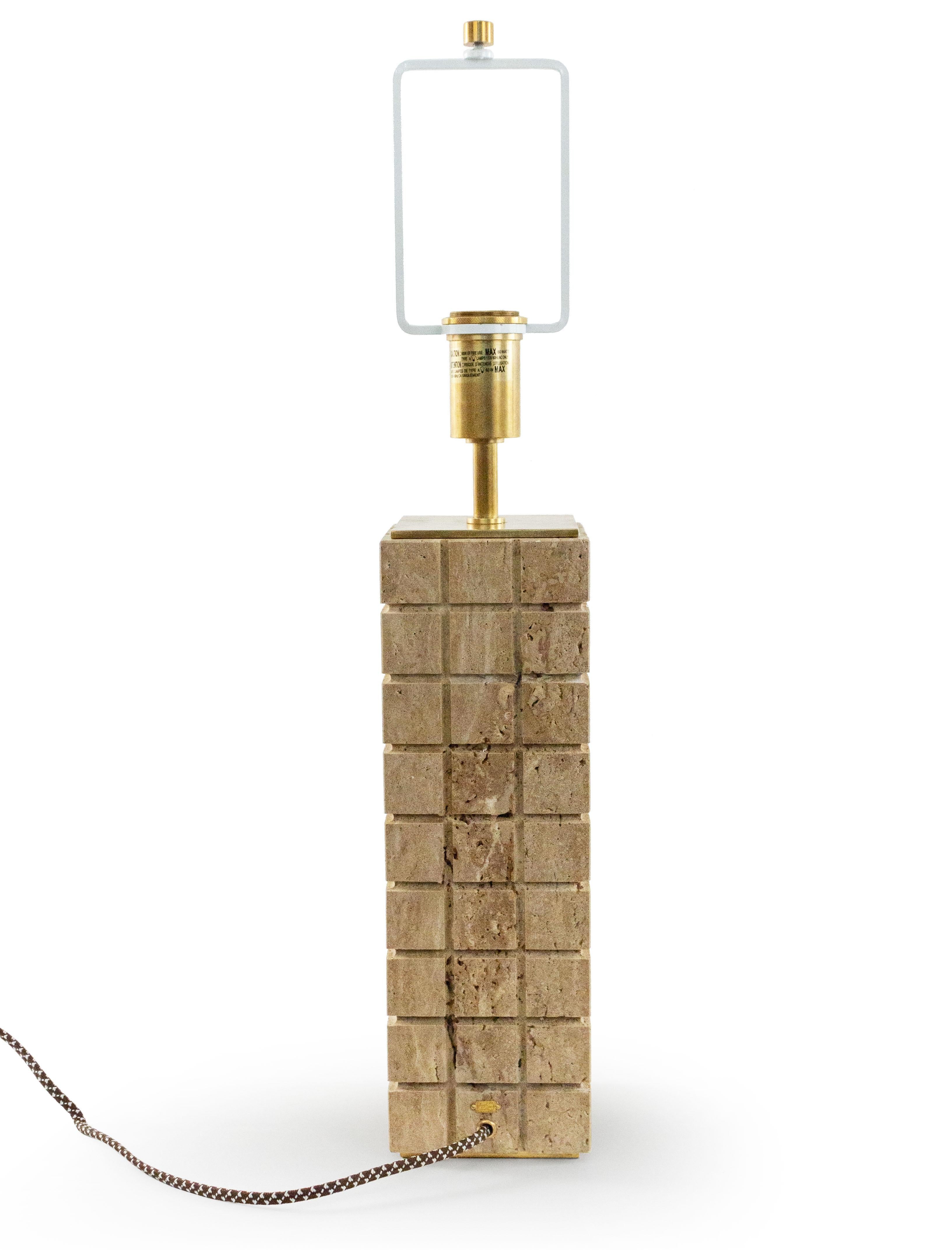 Pair of Contemporary beige cut stone table lamps in a geometric pattern with brass hardware and white metal harp. (Marked on fixture: 