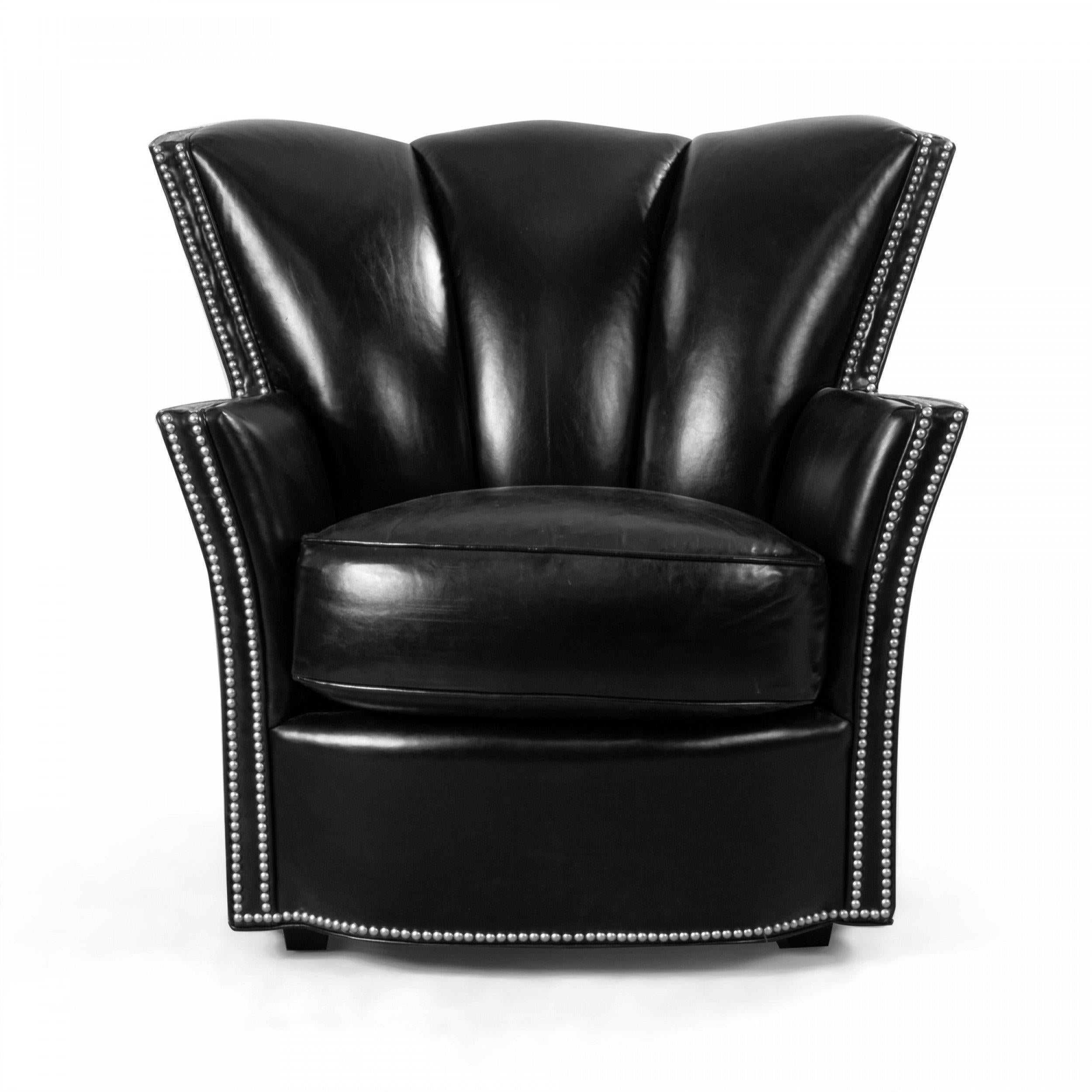 Pair of Contemporary black leather club chairs with thick seat cushions, tufted backs and studded detail along frame and armrests (SWAIM).