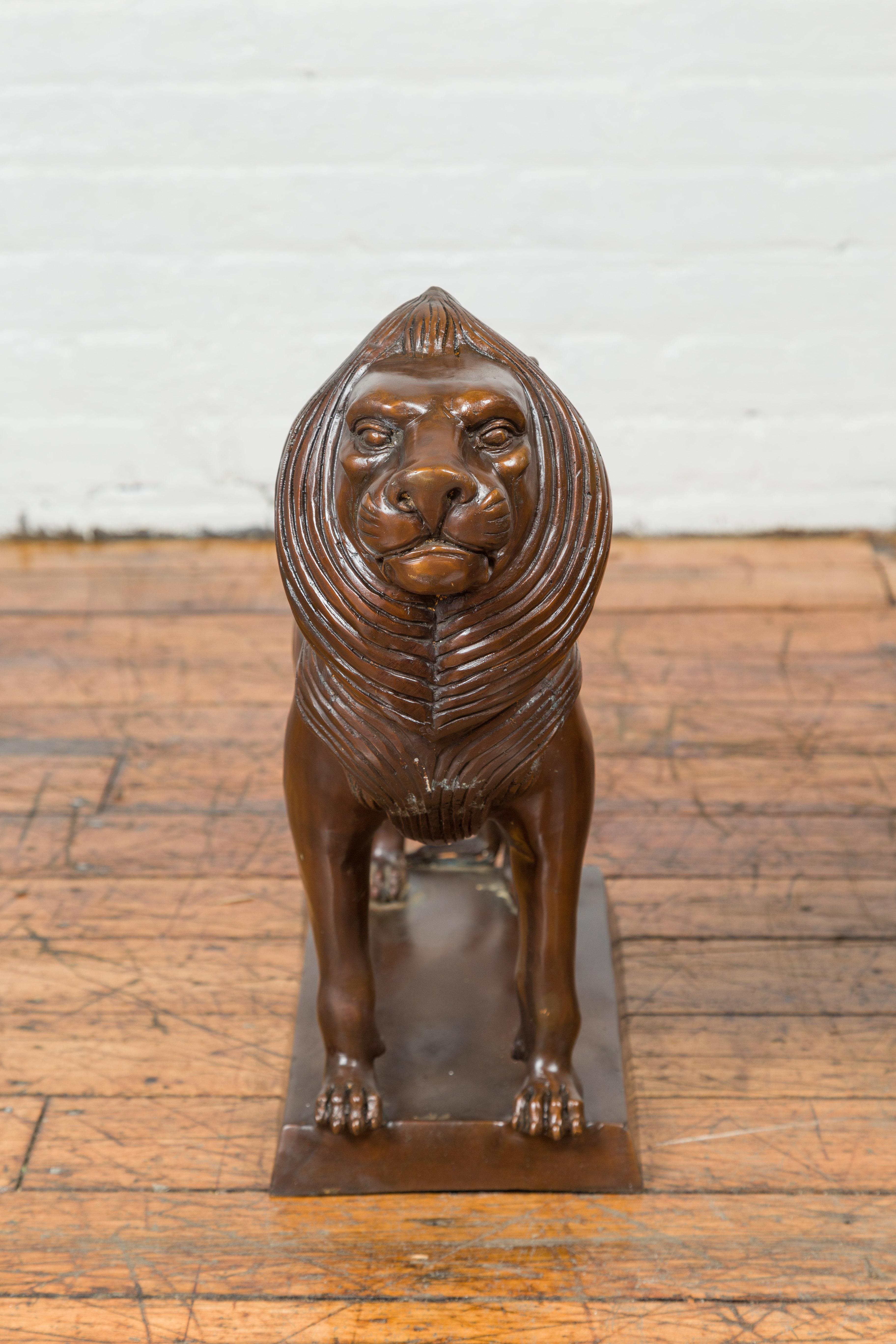 Pair of Contemporary Bronze Lion Sculptures on Bases with Dark Patina In Good Condition For Sale In Yonkers, NY