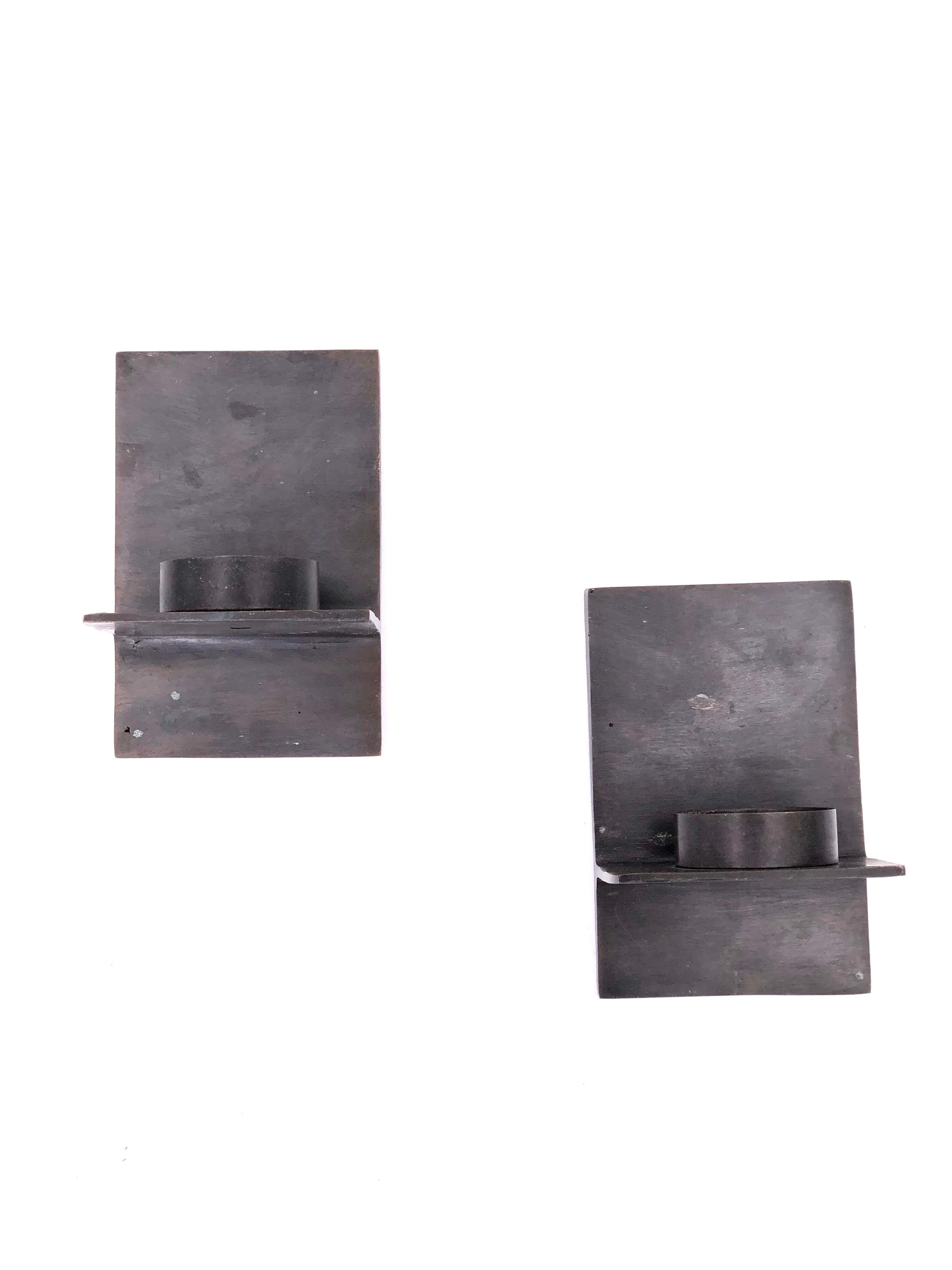 Nice modernist Minimalist pair of wall sconces, solid iron in a patinated bronze finish, solid easy to install, the diameter fits a candle up to 1.75
