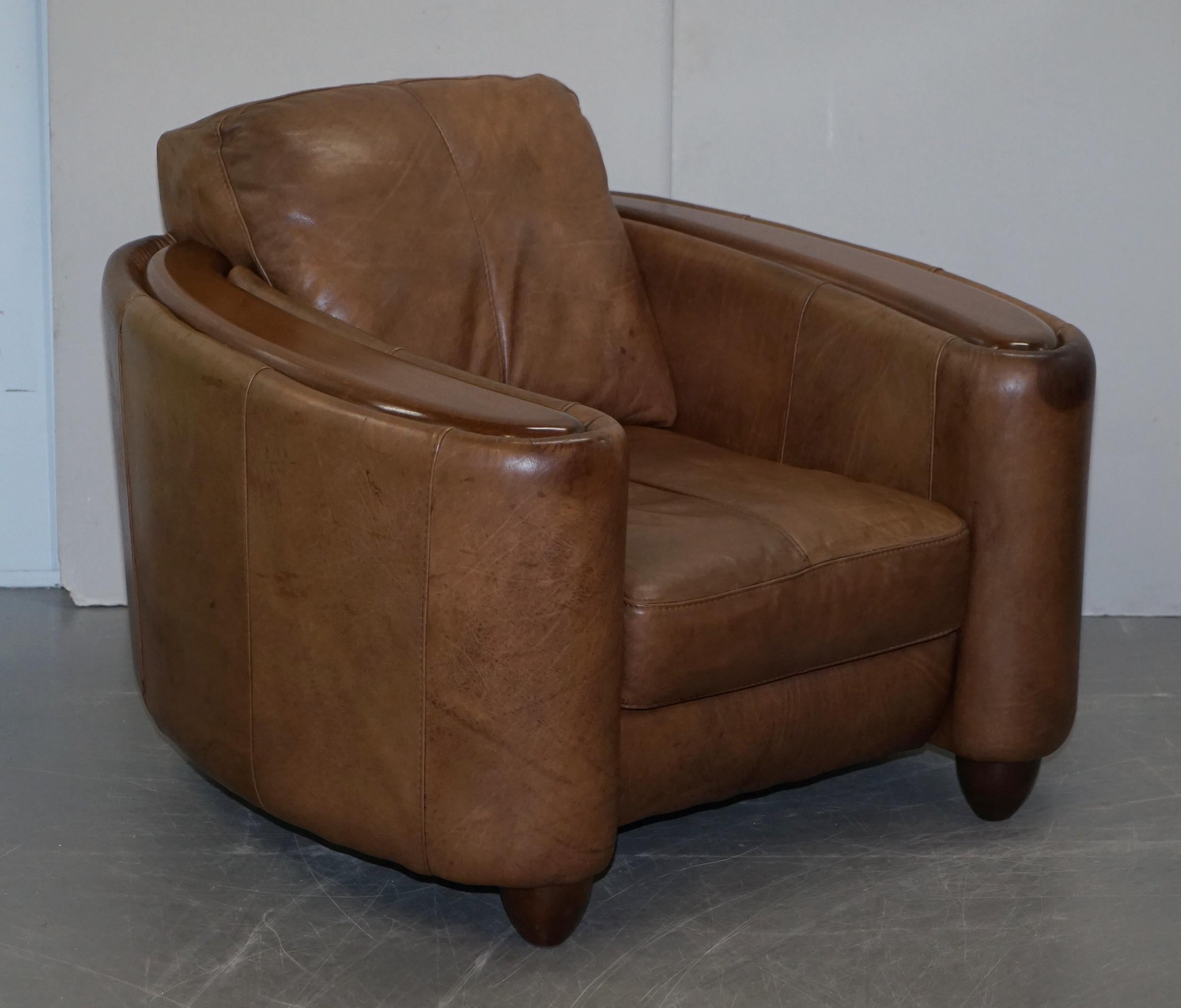 We are delighted to offer for sale this lovely pair of vintage Art Deco style aged brown leather club armchairs with polished mahogany arms

These are very stylish, exceptionally comfortable and well made, the leather is fully aniline which is