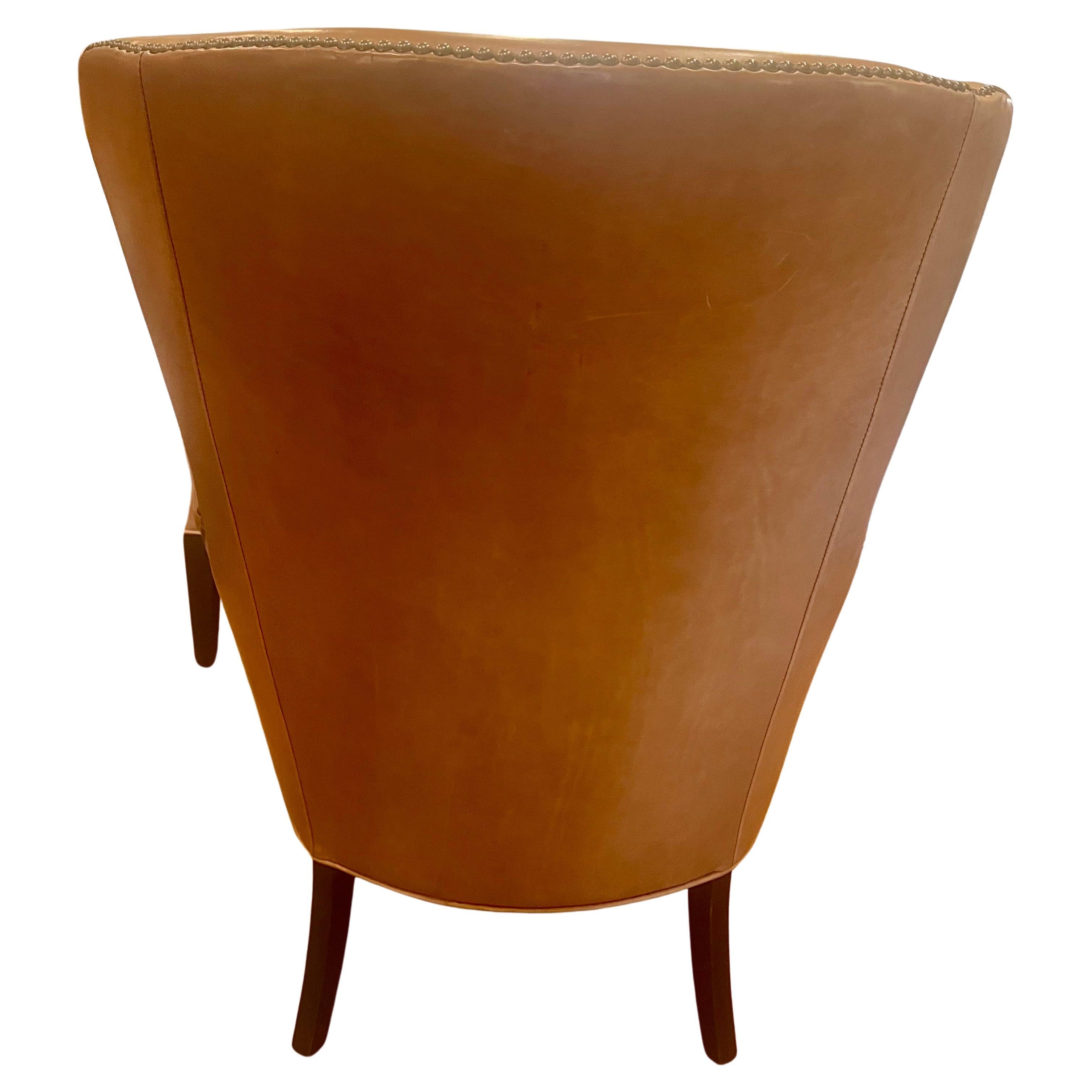 Great pair of caramel color leather wingback chairs by Williams Sonoma, lightly used nice clean condition solid, and sturdy. elegant contemporary and unique style that blends well with mid-century, Danish modern Classic home decor.