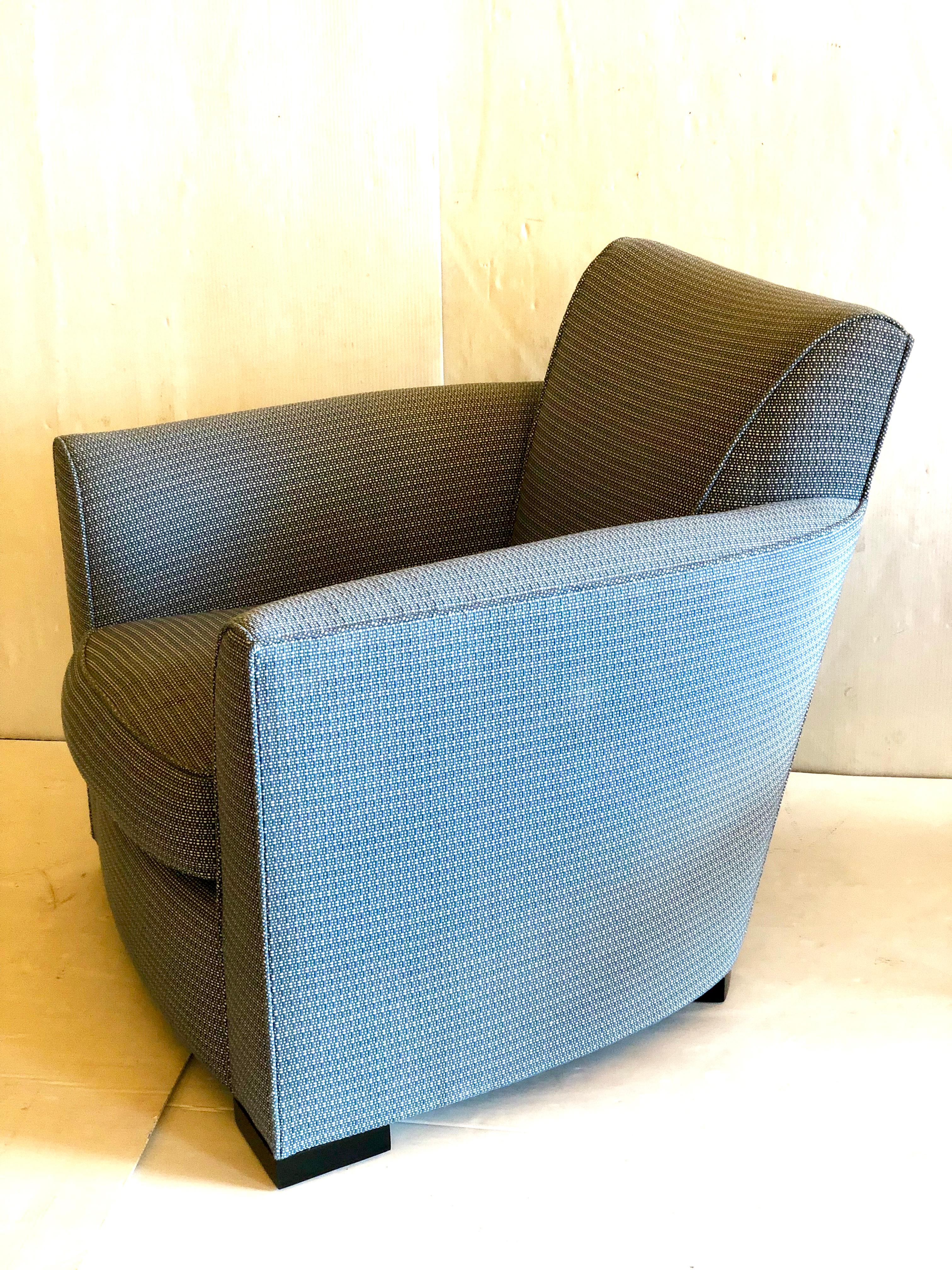 Beautiful and elegant pair of club lounge chairs by Donghia furniture, excellent condition, nice and comfy original fabric non smoker home no stains or tears. With black lacquer legs high quality furniture.