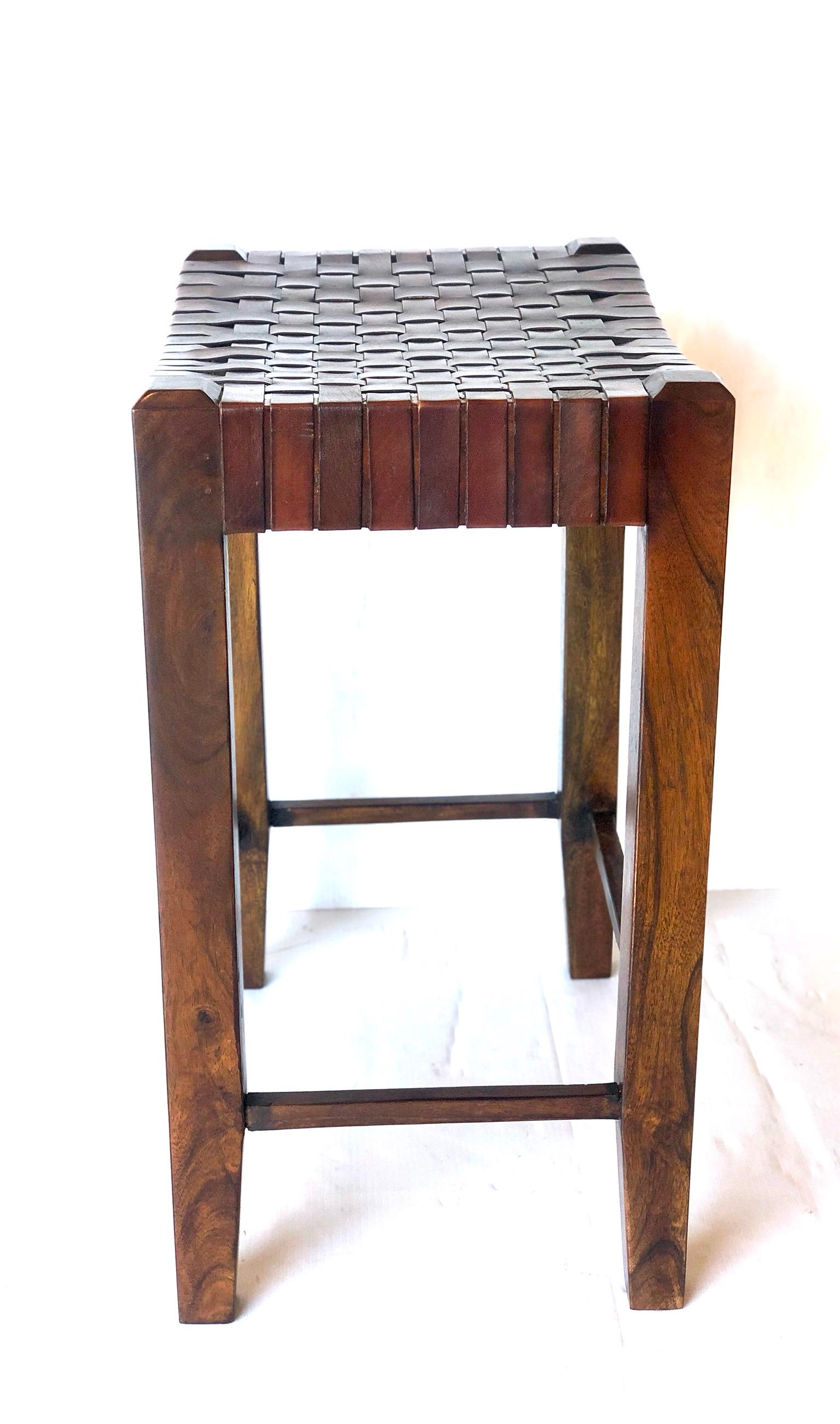 Nice solid walnut wood frame, with leather straps seats in the style of Ralph Lauren. The wood has been oiled overall good condition solid and sturdy. Nicely light worn leather. Counter stools.