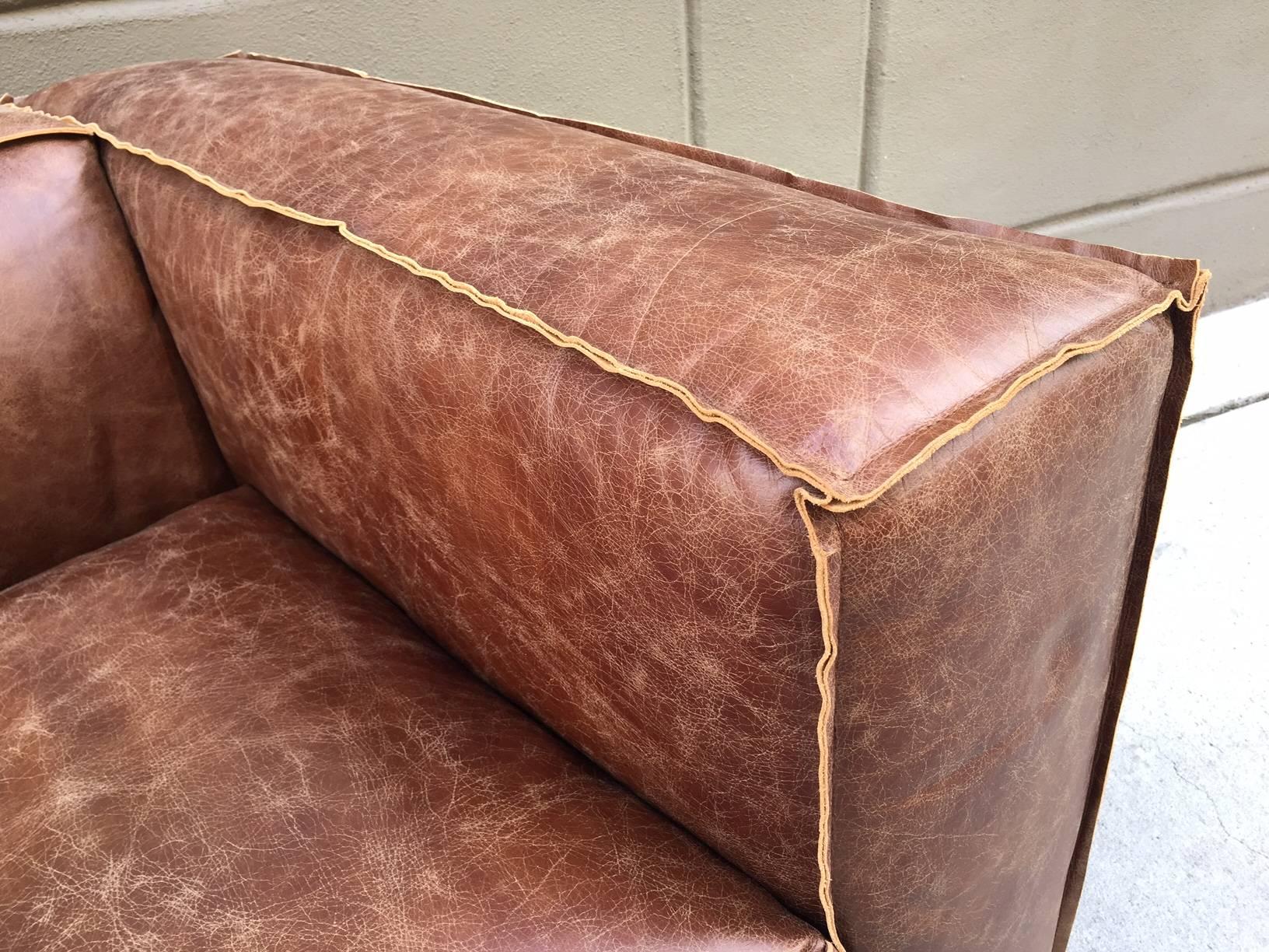 distressed tan leather sofa