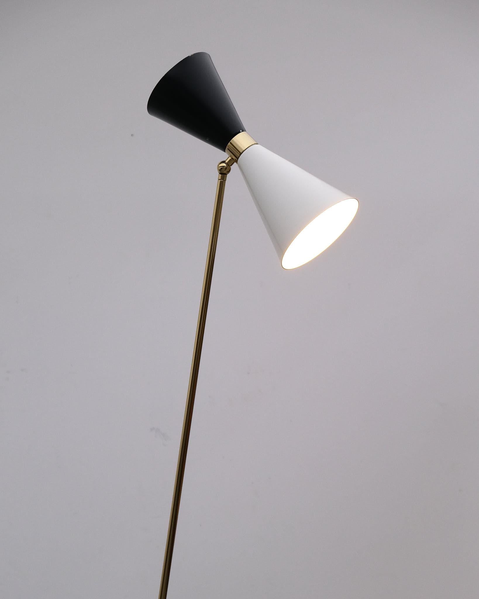A striking pair of contemporary floor lamps in the style of Stilnovo, crafted from brass and lacquered metal. Featuring clean lines, sculptural silhouettes, and elegant proportions, these lamps echo the refined modernism associated with Italian