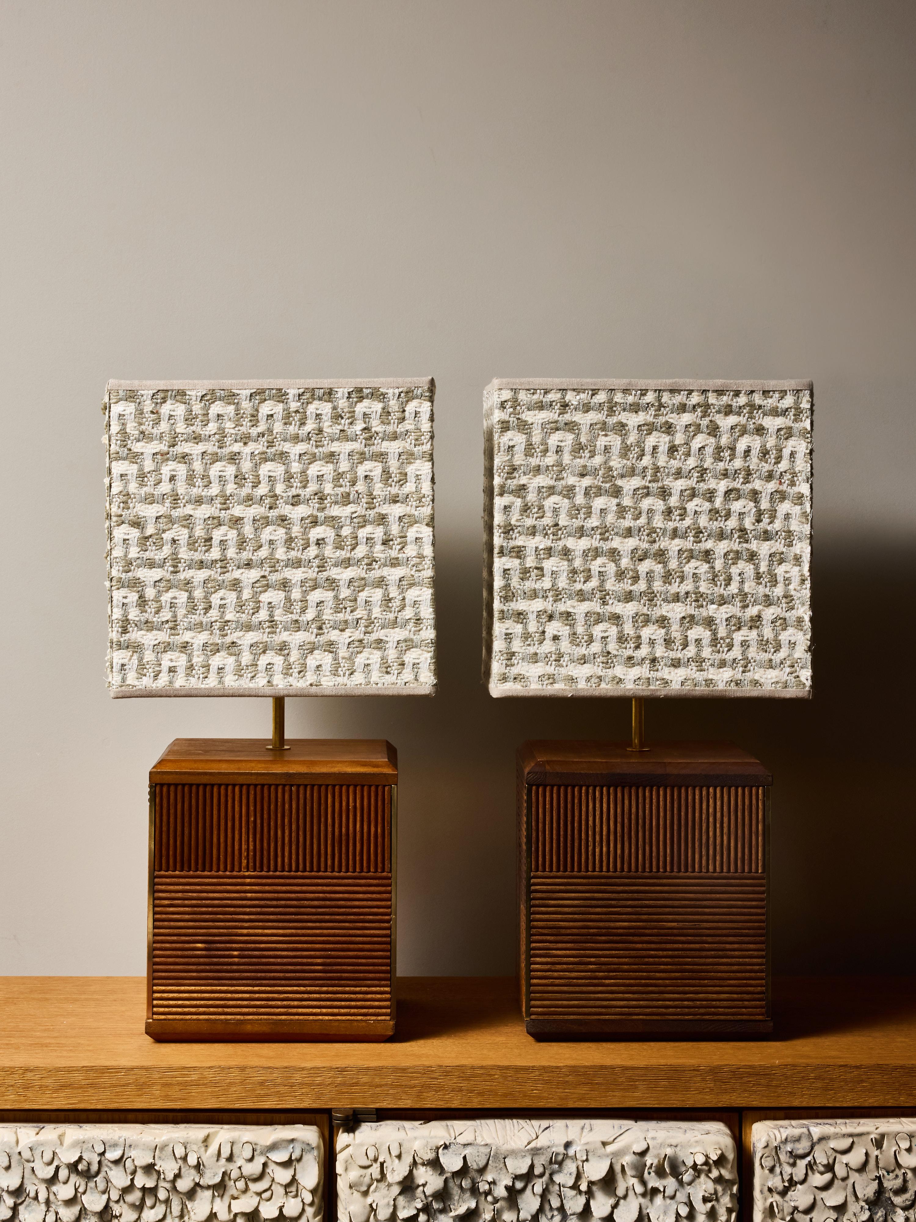 Sophisticated pair of contemporary table lamps featuring meticulously crafted fluted wooden bases arranged in a striking geometric composition. Each cube-shaped base is built from alternating vertical and diagonal ribbed wood panels, producing a