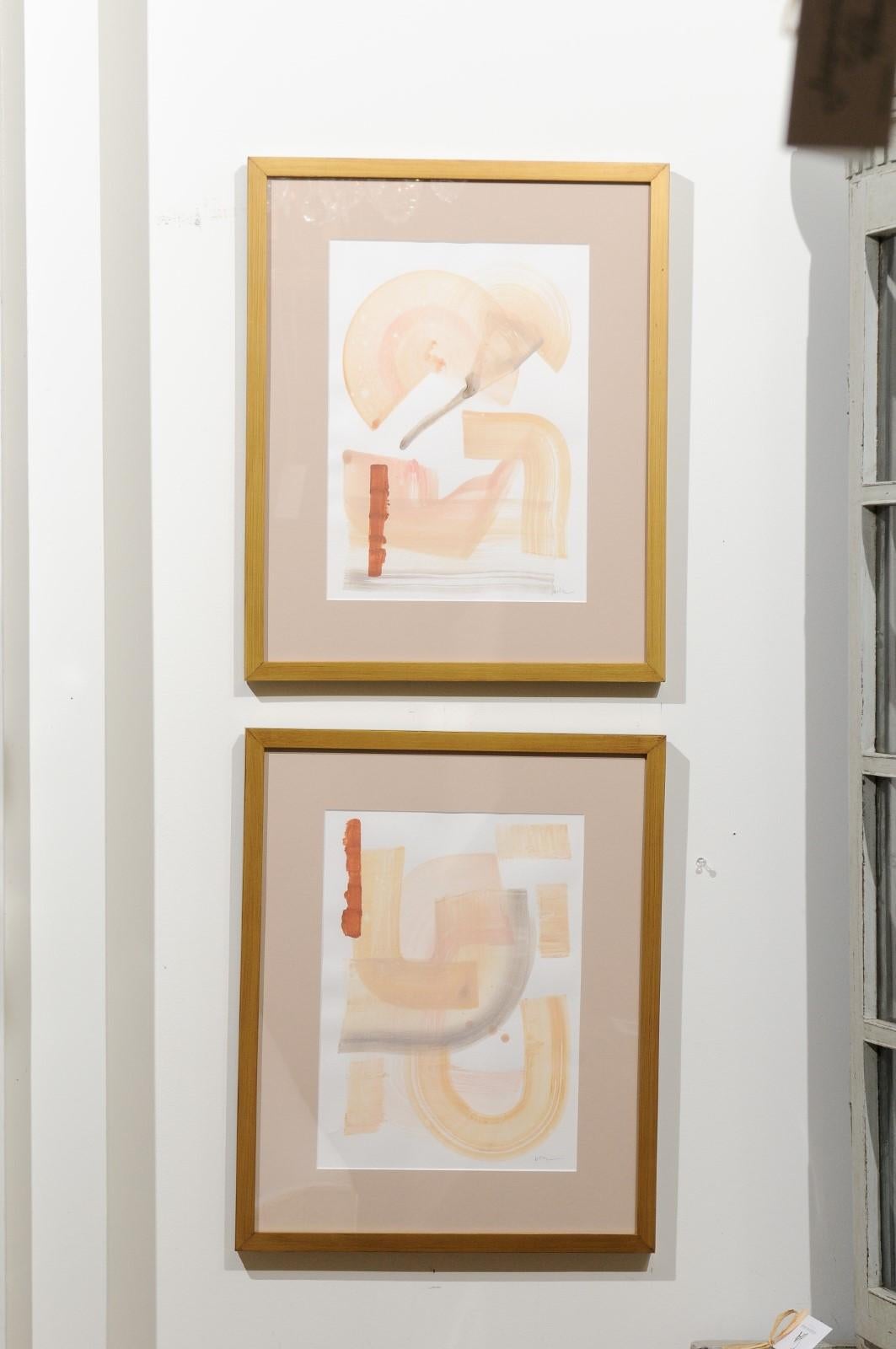 'Calm Heart 1 and 2', pair of original contemporary framed abstract paintings on cold pressed watercolor paper. Each of this pair of American abstract acrylic paintings features soft marks with muted colors and playful curvy shapes. Set inside