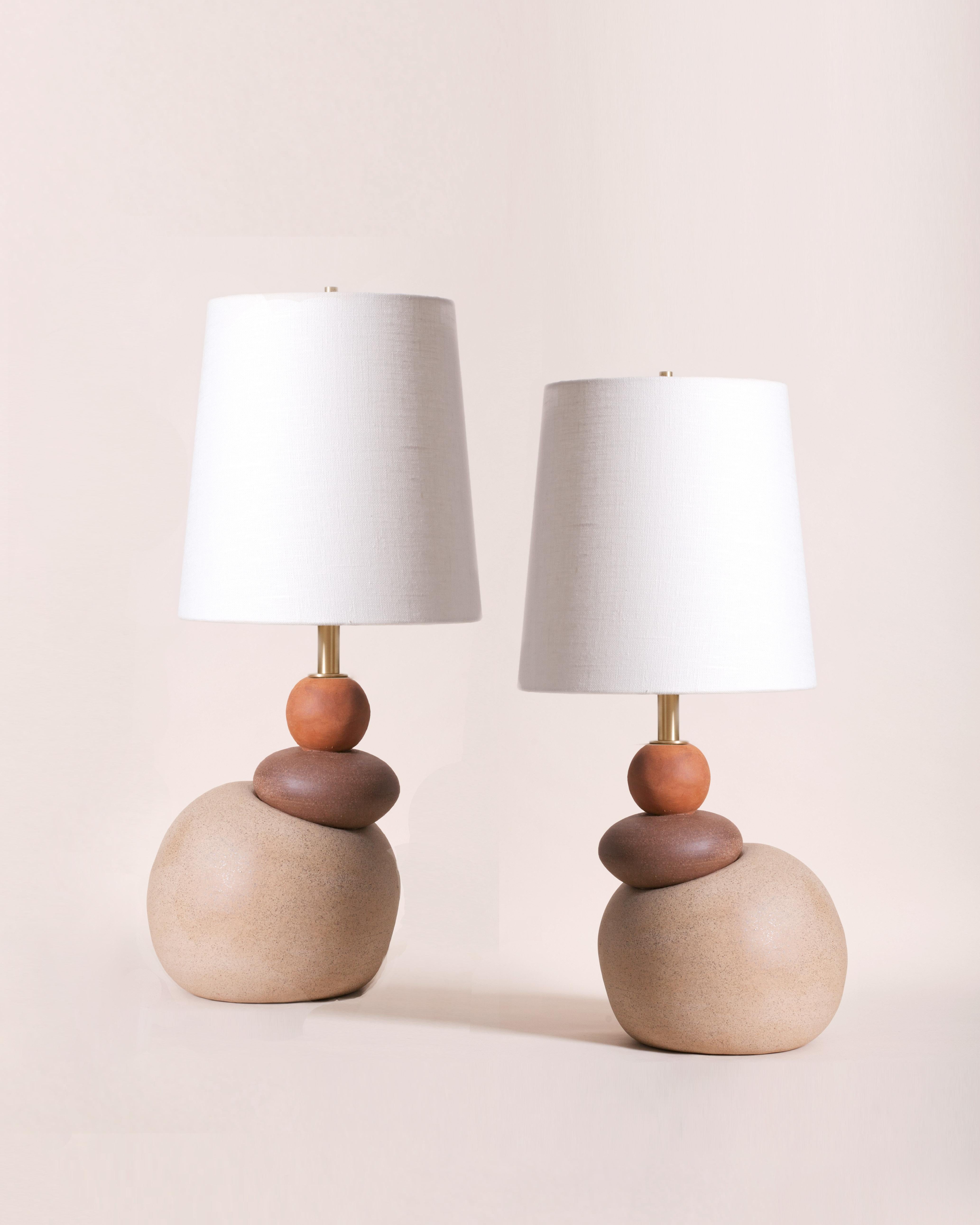 One of a kind ceramic lamps, thrown on the potters wheel and assembled by hand. The lamp base is comprised of three different clay bodies and features a raw, unglazed ceramic surface to highlight the texture of natural clay. These pieces were