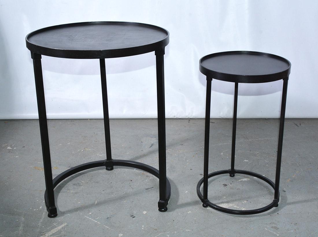 The pair of contemporary black iron round side tables stack by sliding the smaller unit under the taller one. Padded unscratchable feet. Work well on a porch or terrace. End table, occasional tables.

Smaller table: D 11.25 H 20.25.