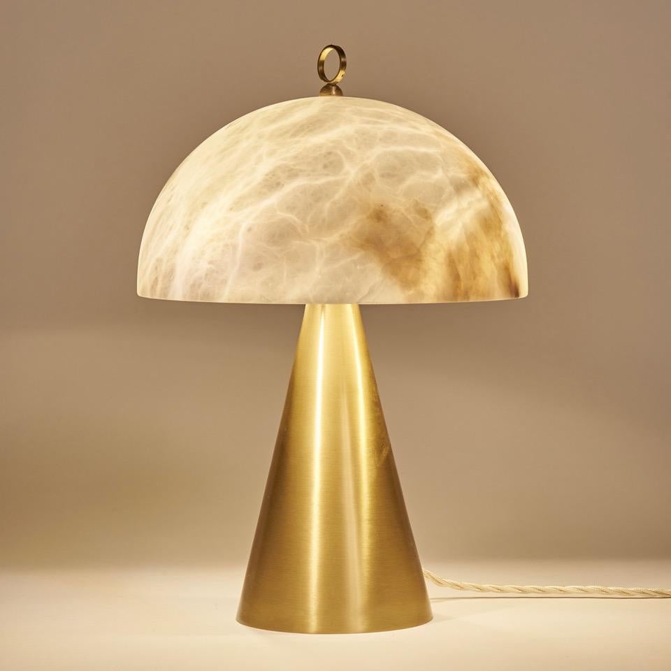 The compact size of this table lamp makes it a perfect choice for smaller spaces or as an accent piece on bedside tables or wall cabinets. Despite its small size, the lamp's design is visually striking and impactful, with the veins of the natural