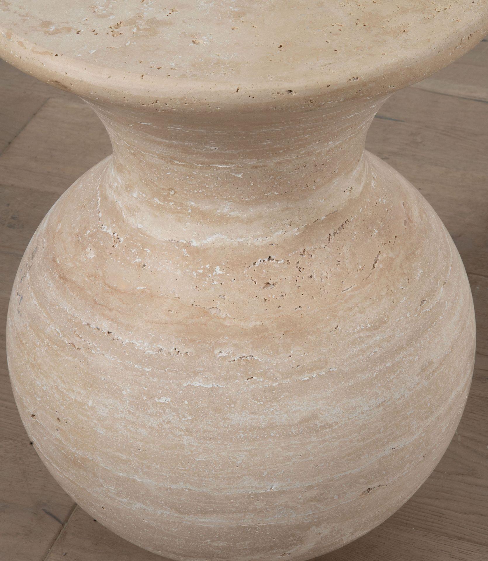 Unusual pear shaped contemporary side tables from Italy in Mid Century style.
Made from one piece of travertine.