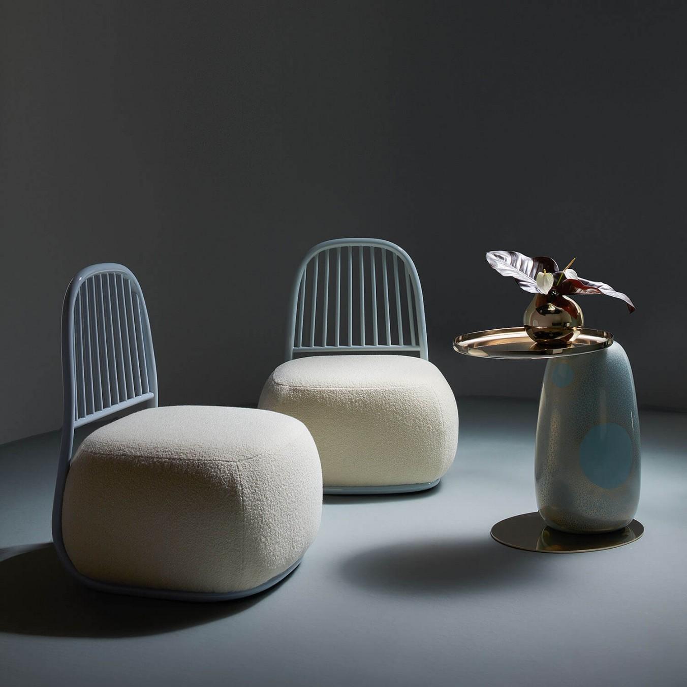 Pair of Contemporary Ivory Upholstered Lounge Chairs - Circe by Ini Archibong

Inviting and almost animated, the Circe Lounge Chair has a playful personality. With a deep upholstered seat and harp-like back, Archibong says that it “provides
