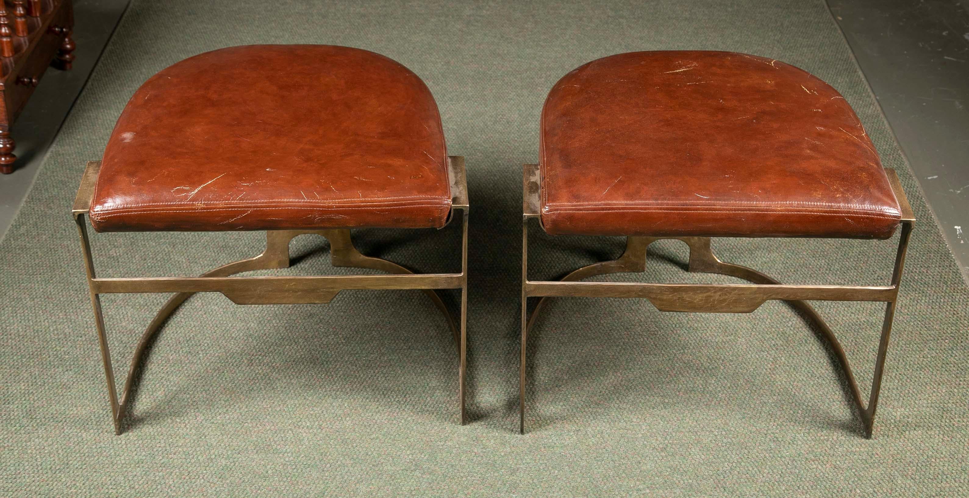 Pair of contemporary leather and patinated bronze stools.