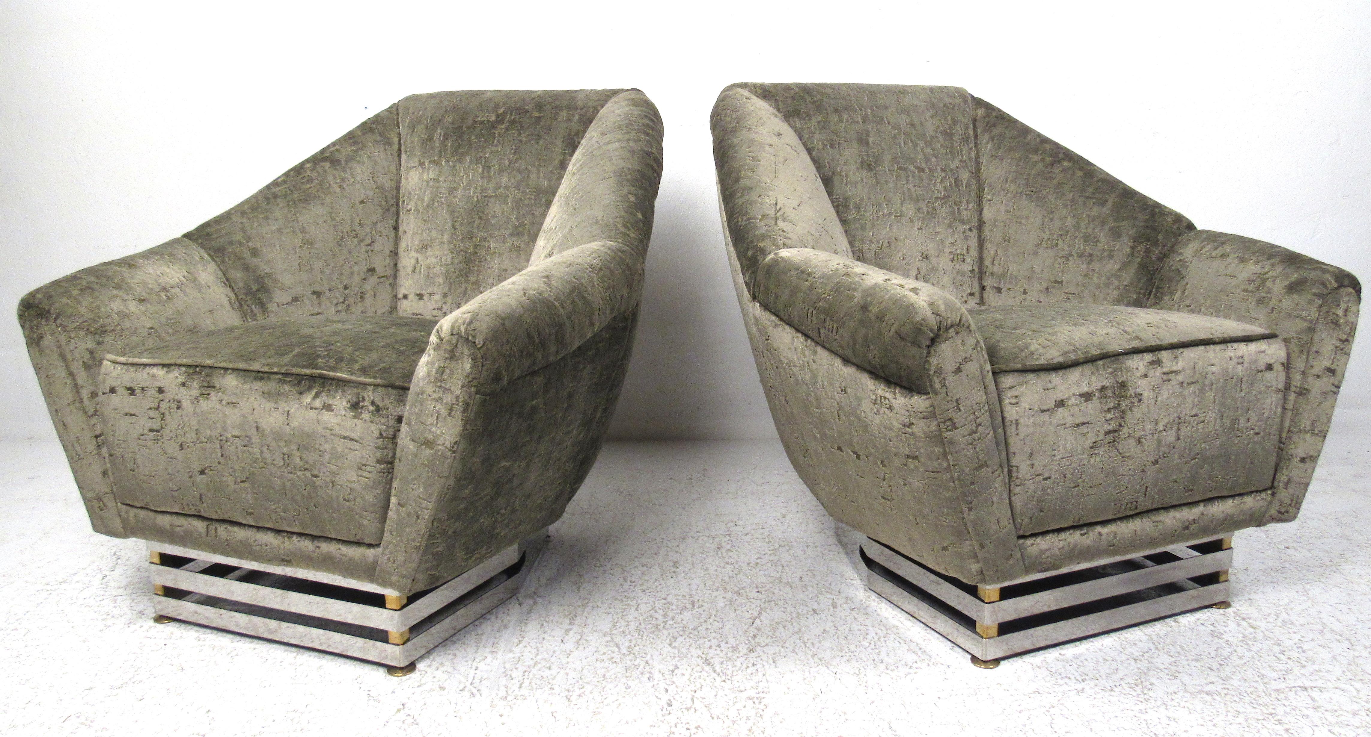 Stylish pair of Italian lounge chairs with unique brass and chrome bases by modernist designer Romeo Rega. Please confirm the item location (NY or NJ) with the dealer.