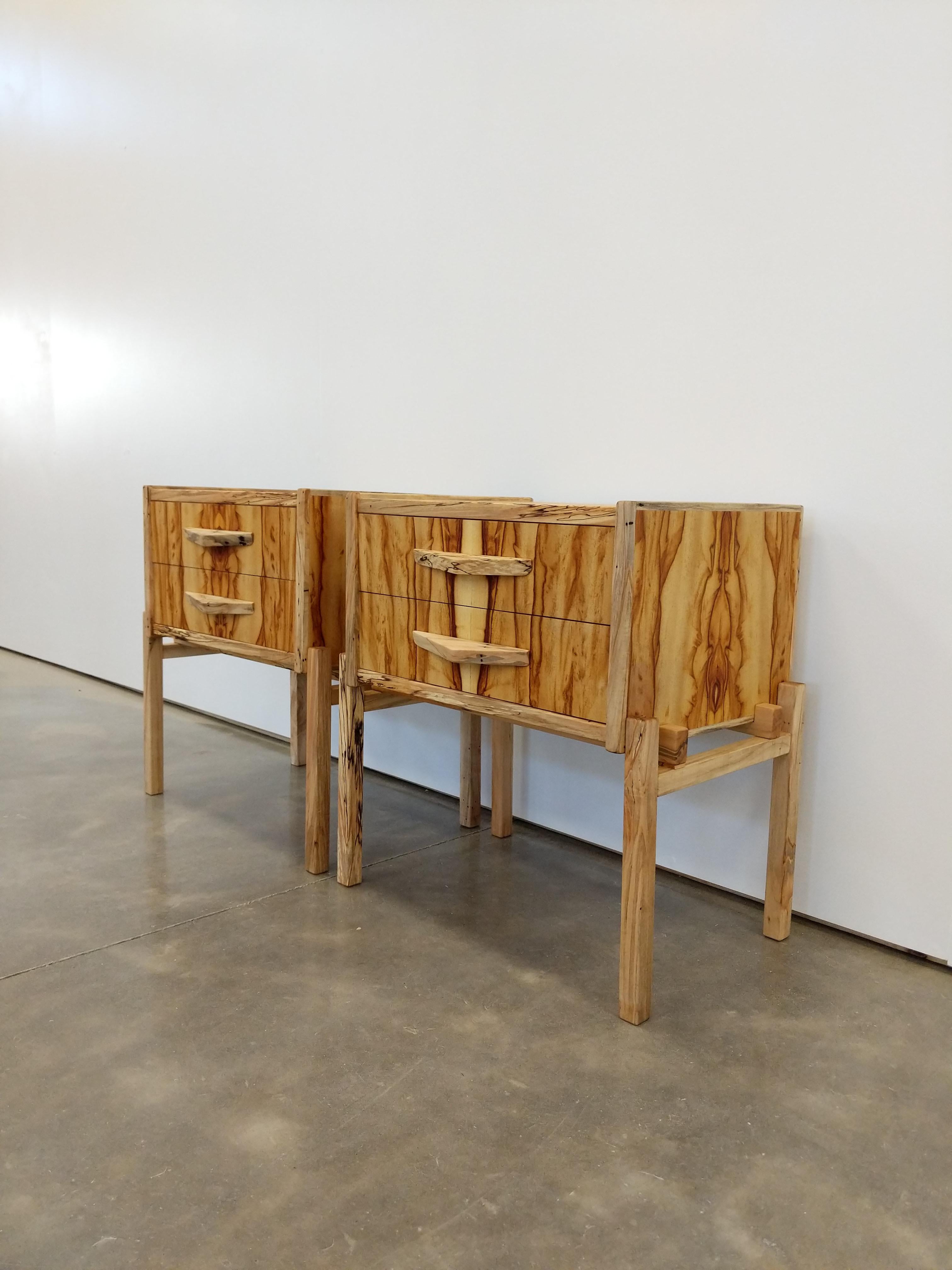 Pair of contemporary nightstands / side tables / low chests of drawers in chechen and spalted maple.

Handmade at our workshop in NY in a Modernist style using the highest quality materials available.

The bold chechen wood grain is complemented by