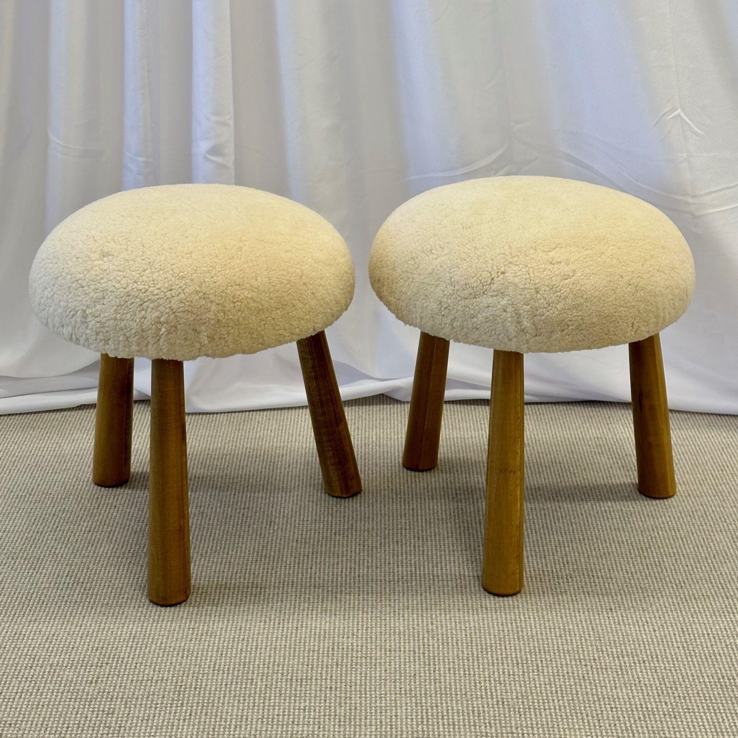 Pair of Contemporary Scandinavian Modern style sheepskin foot-stools / ottomans
Contemporary organic form tri-pod stools or ottomans. New memory foam cushioning and genuine shearling. Can mix and match beige or honey sheepskin color stools. The