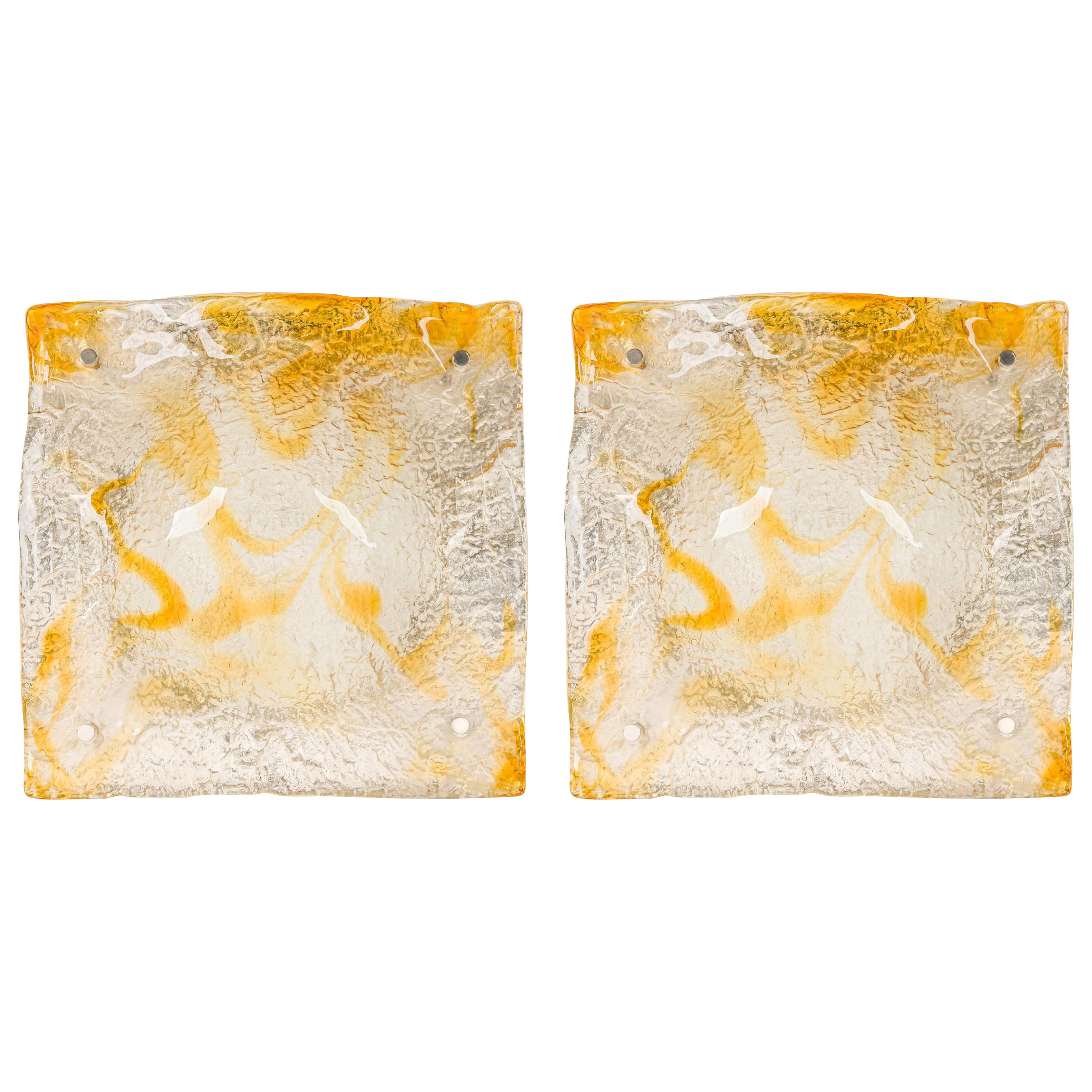 Pair of Contemporary textured amber glass sconces w/ half-round freeform design