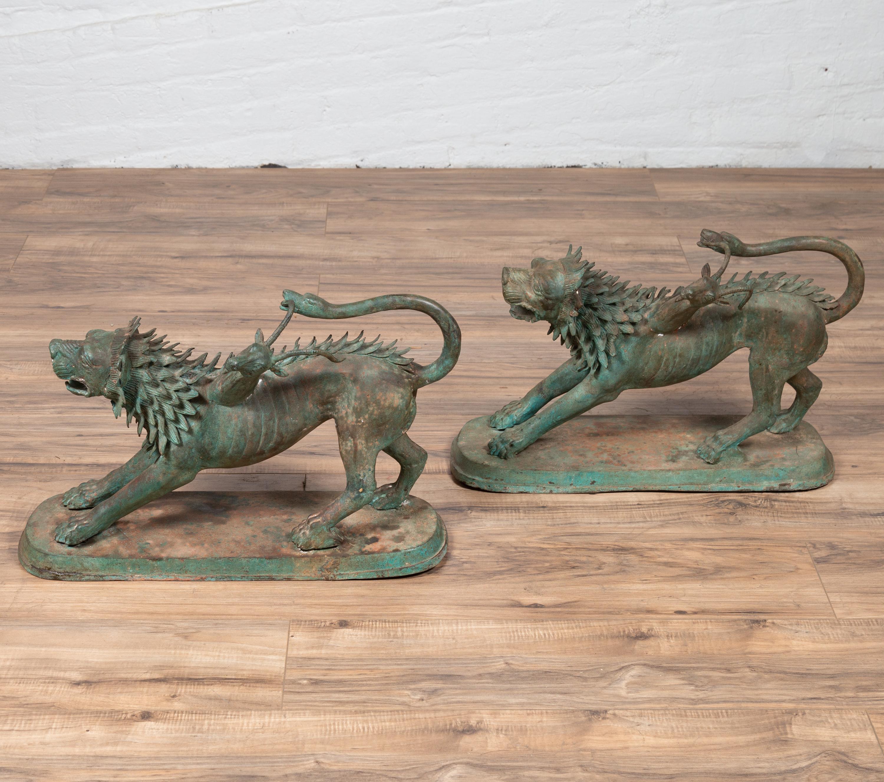 A pair of contemporary cast bronze mythological guardian animal sculptures in verdigris patina. Attracting our attention with their striking appearance, this pair of bronze sculptures was created with the traditional technique of the lost-wax (à la