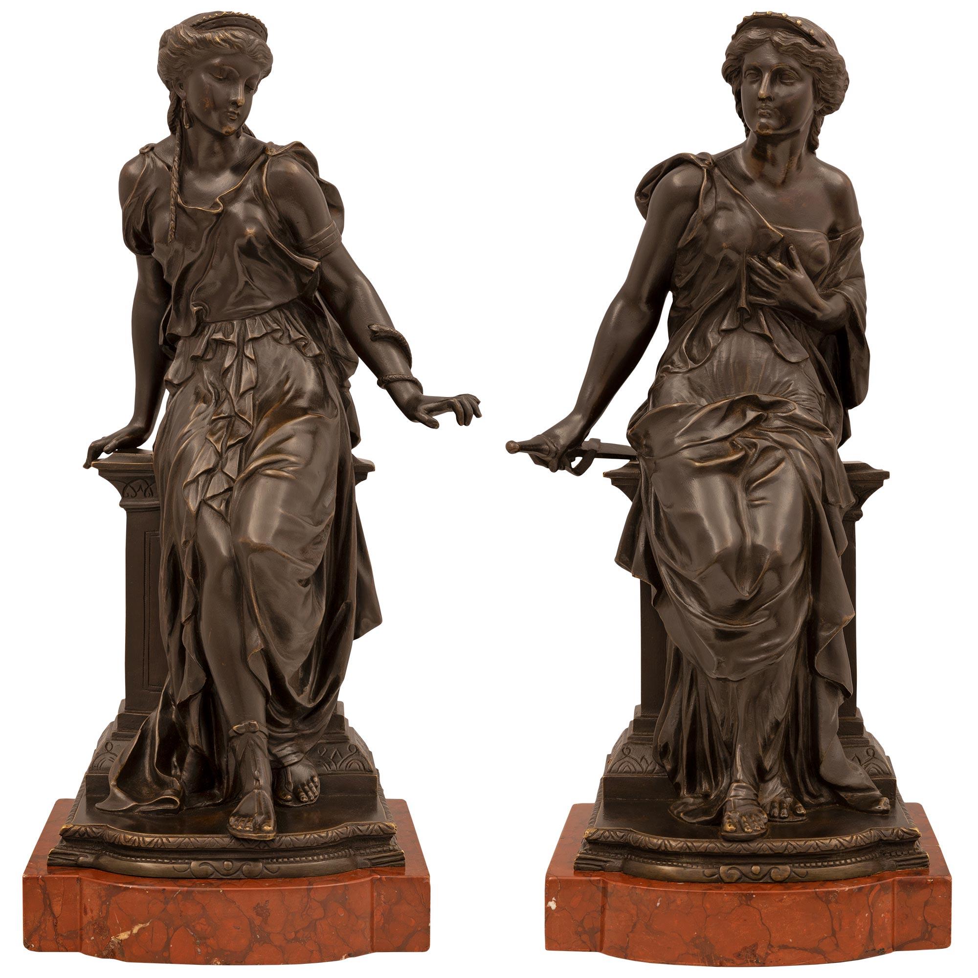 A remarkable and high quality pair of Continental 19th century Neo-Classical st. patinated bronze and Rouge Griotte marble statues, attributed to J. Feiffer. Each statue is raised by a fine Rouge Griotte marble base with a rounded front. The