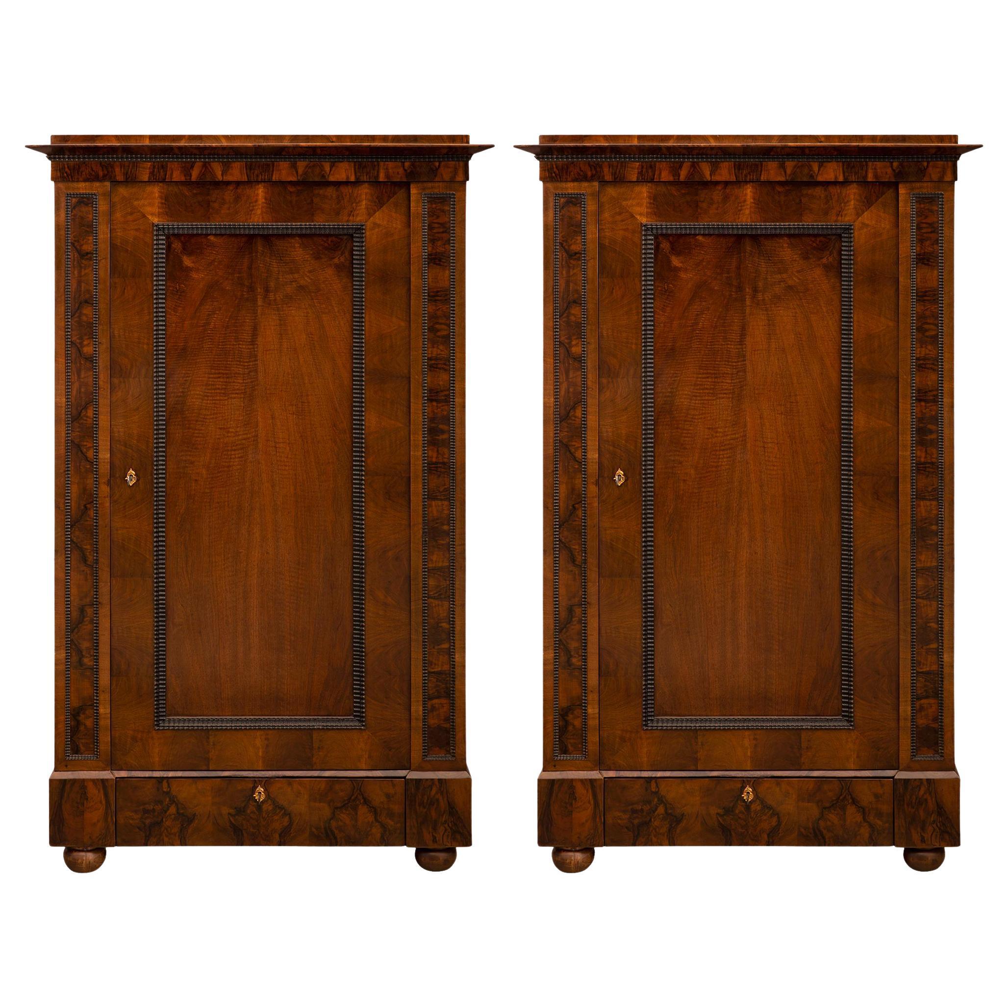 Pair of Continental 19th Century Neo-Classical St. Walnut and Fruitwood Cabinets